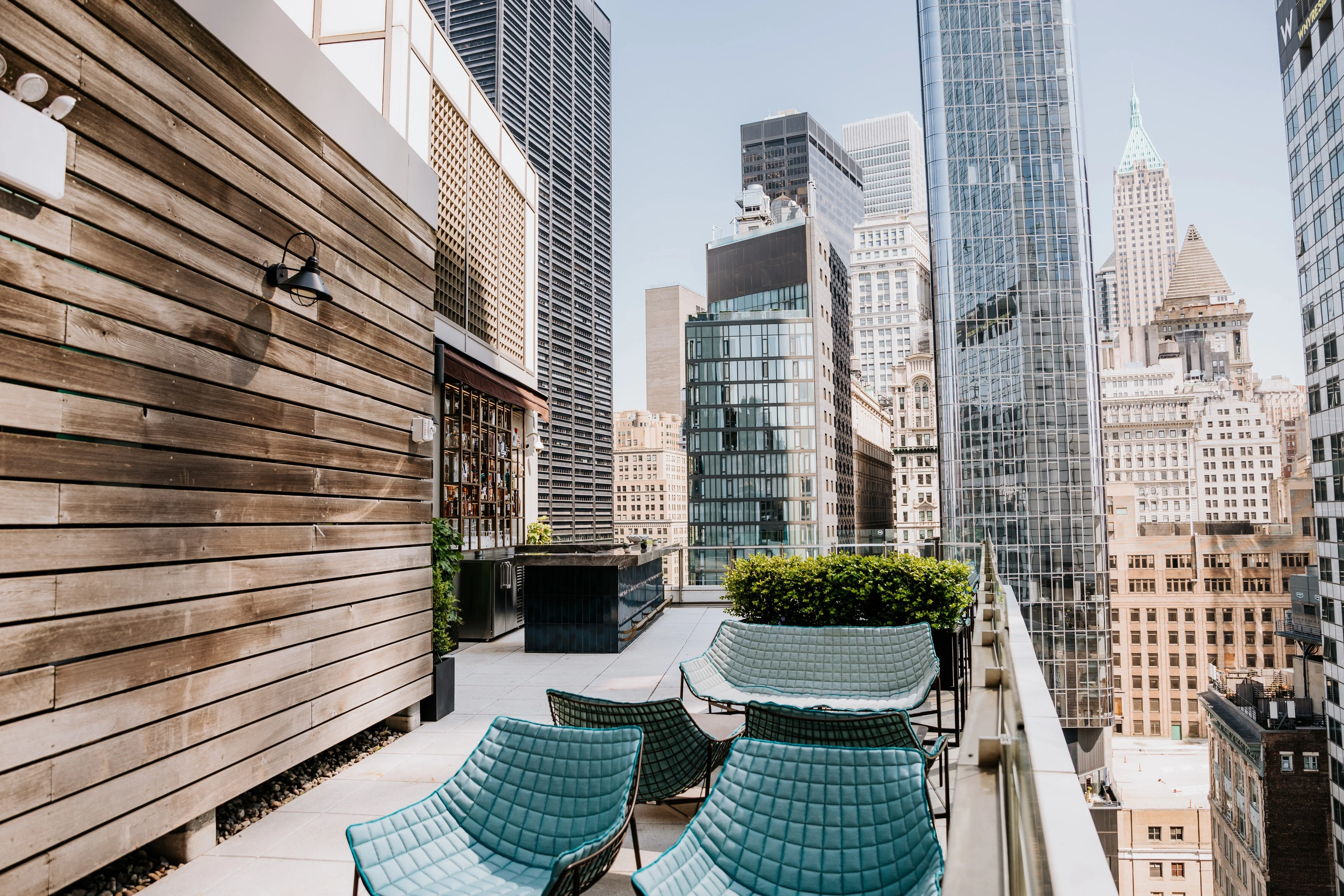 Rooftop terrace with city skyline views and modern seating