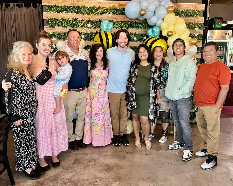 A group of friends and family celebrating at Mama Kim's