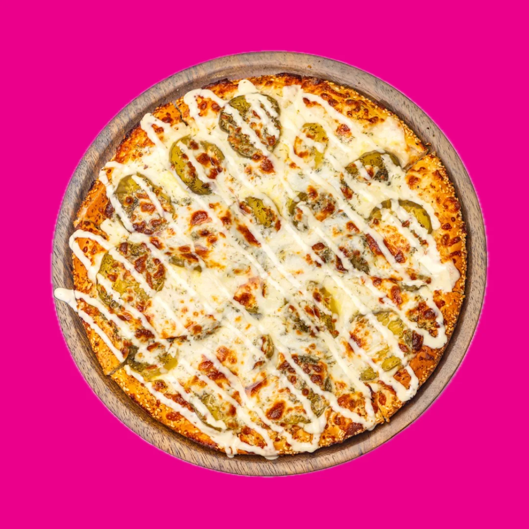 Delicious pickle pizza with creamy drizzle
