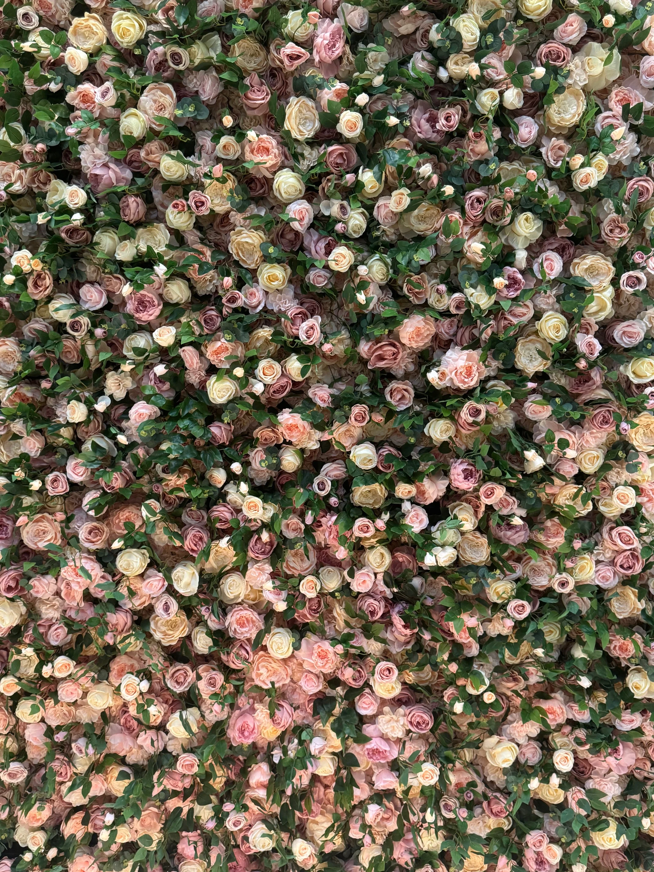Vibrant floral wall with assorted roses and greenery