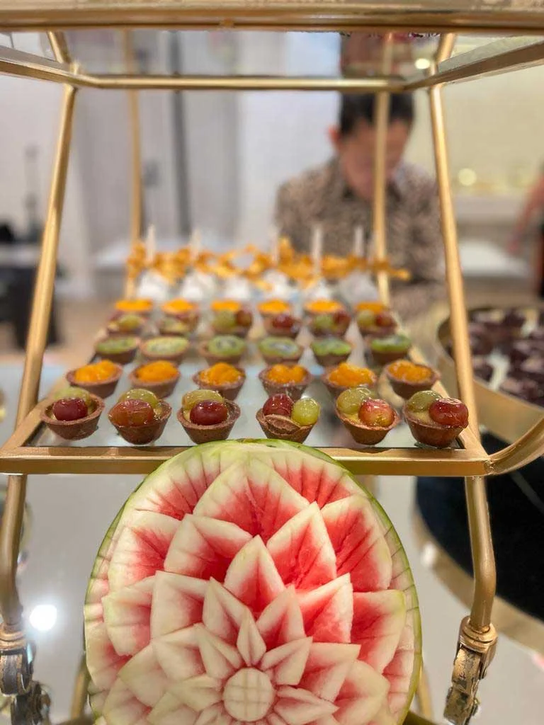 Artfully arranged Thai desserts on a decorative stand