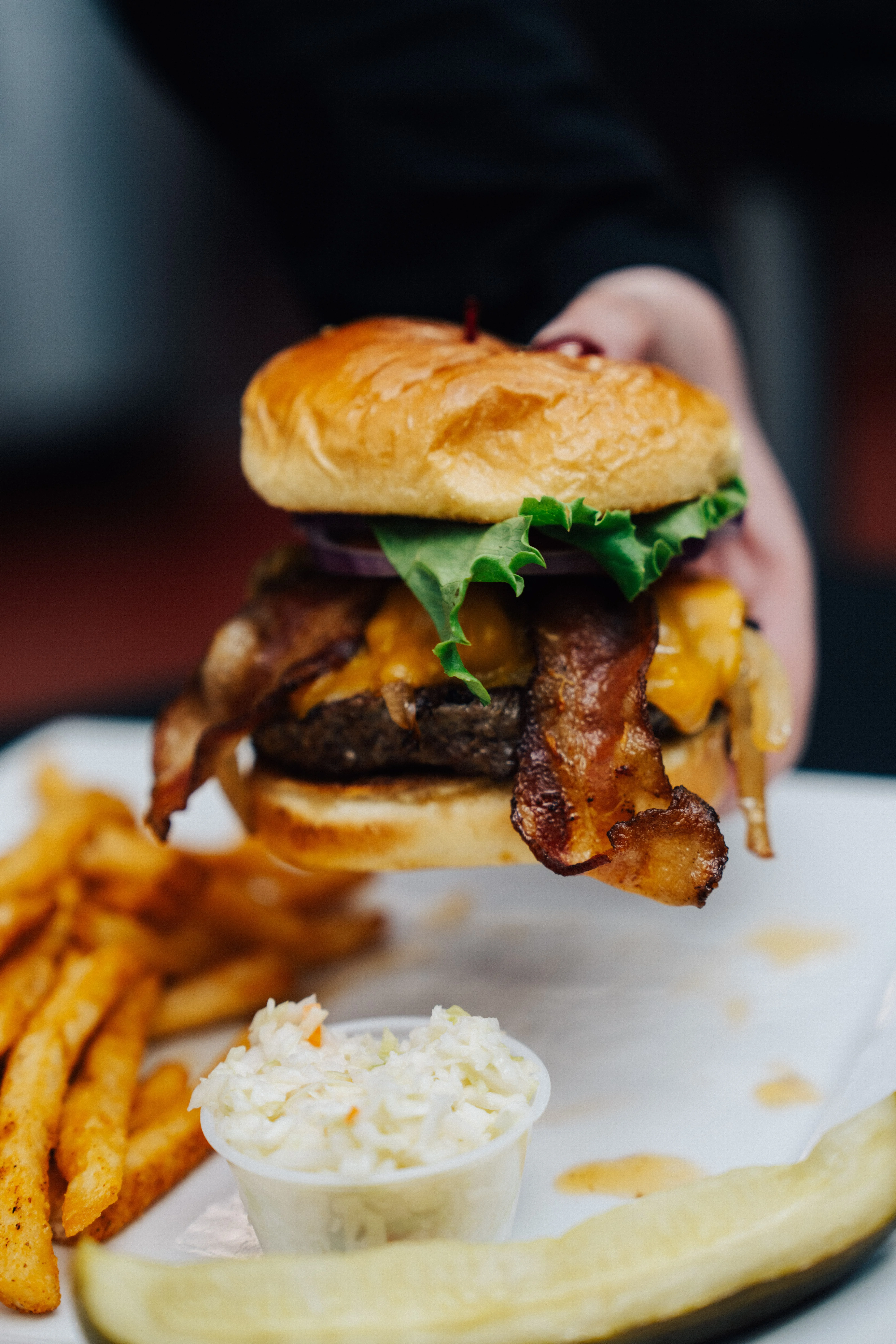Juicy cheeseburger with bacon and fries