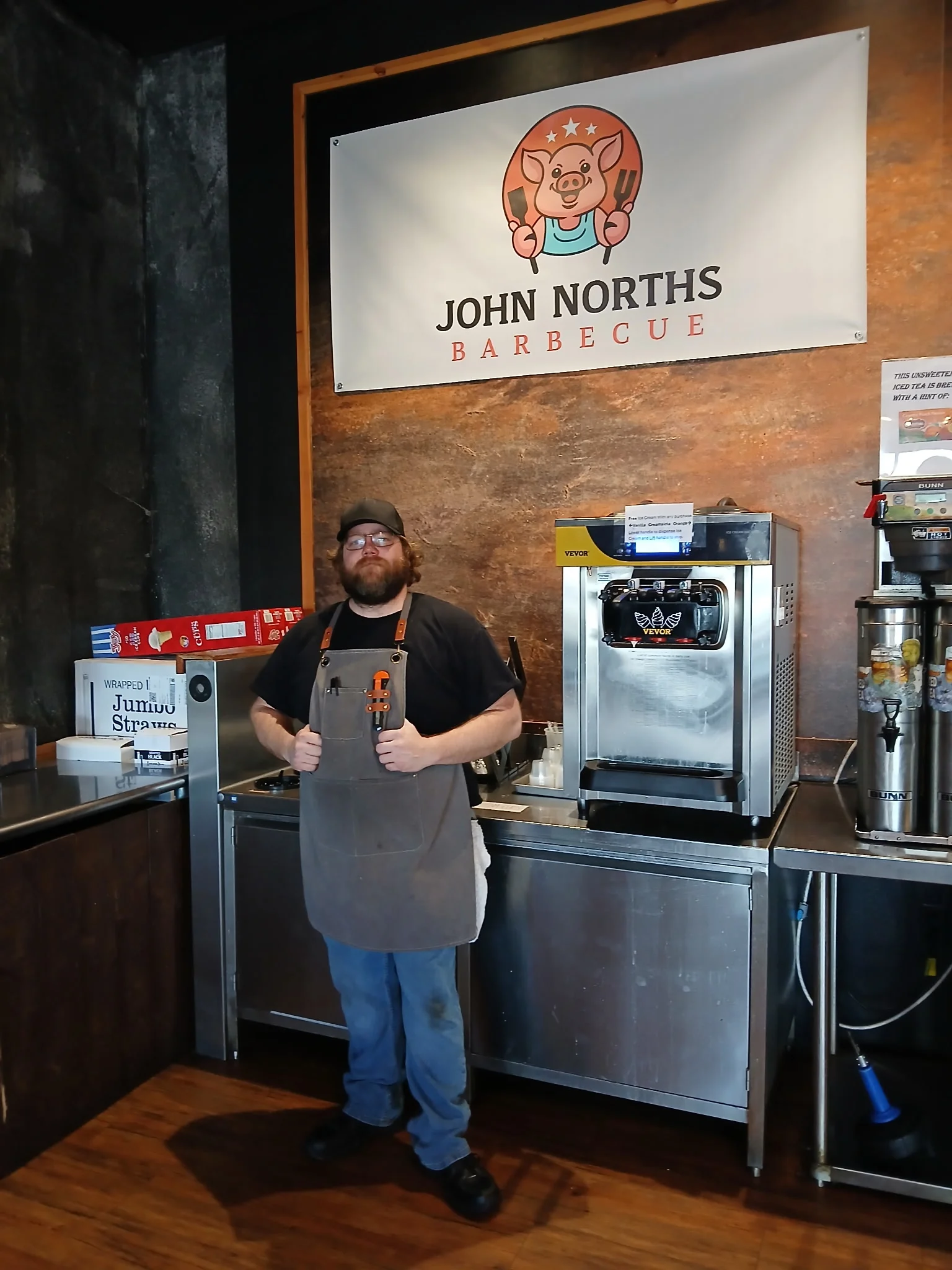 Barbecue restaurant interior with staff member