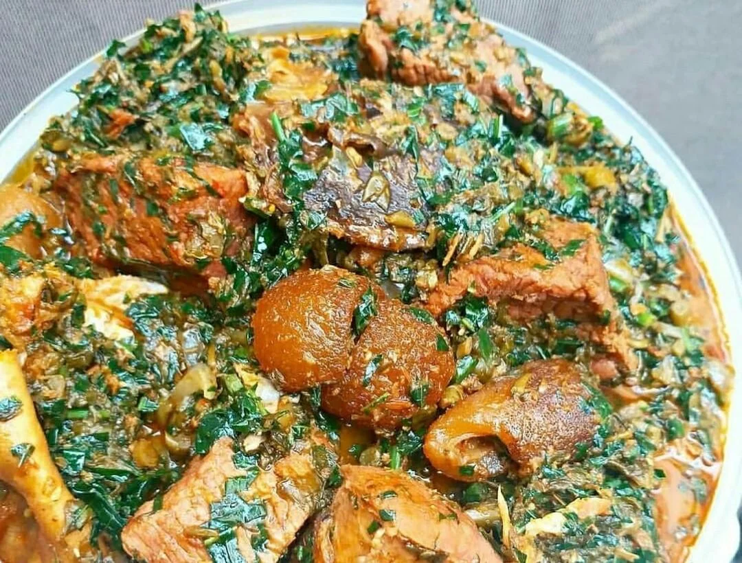 Nigerian egusi soup with assorted meats and leafy greens