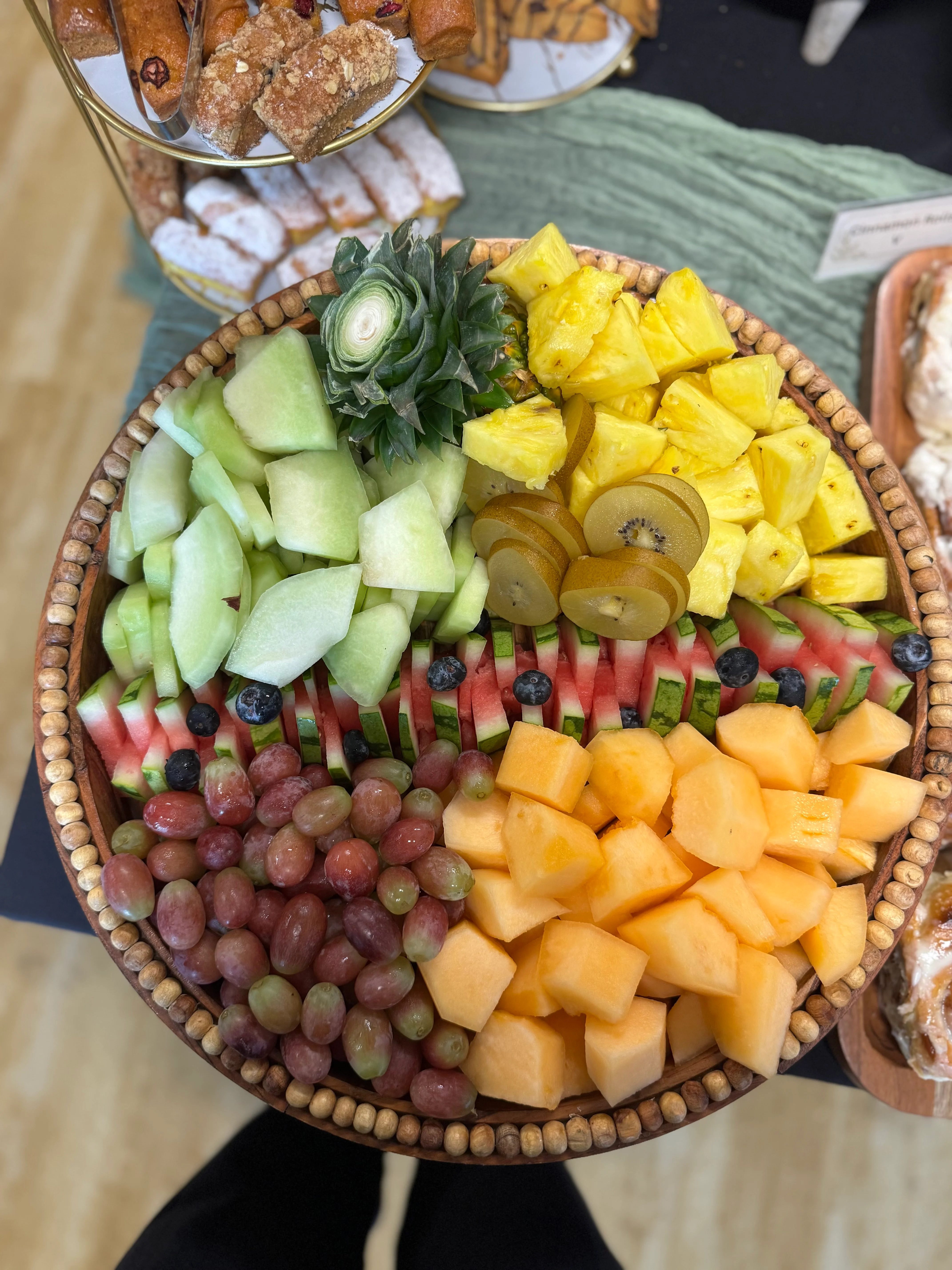Assorted fresh fruit platter with pastries