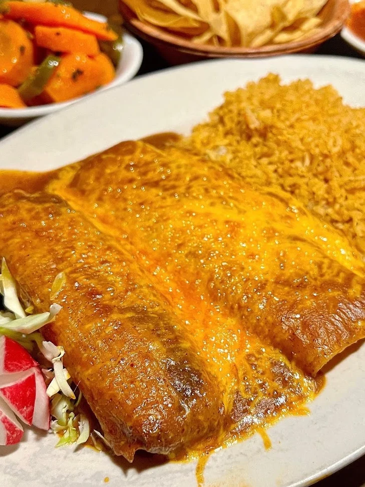 enchilada combo plate with rice and beans