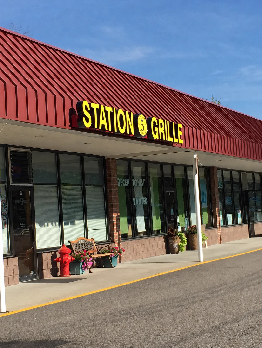 Exterior view of Station 5 Grille restaurant with vibrant signage