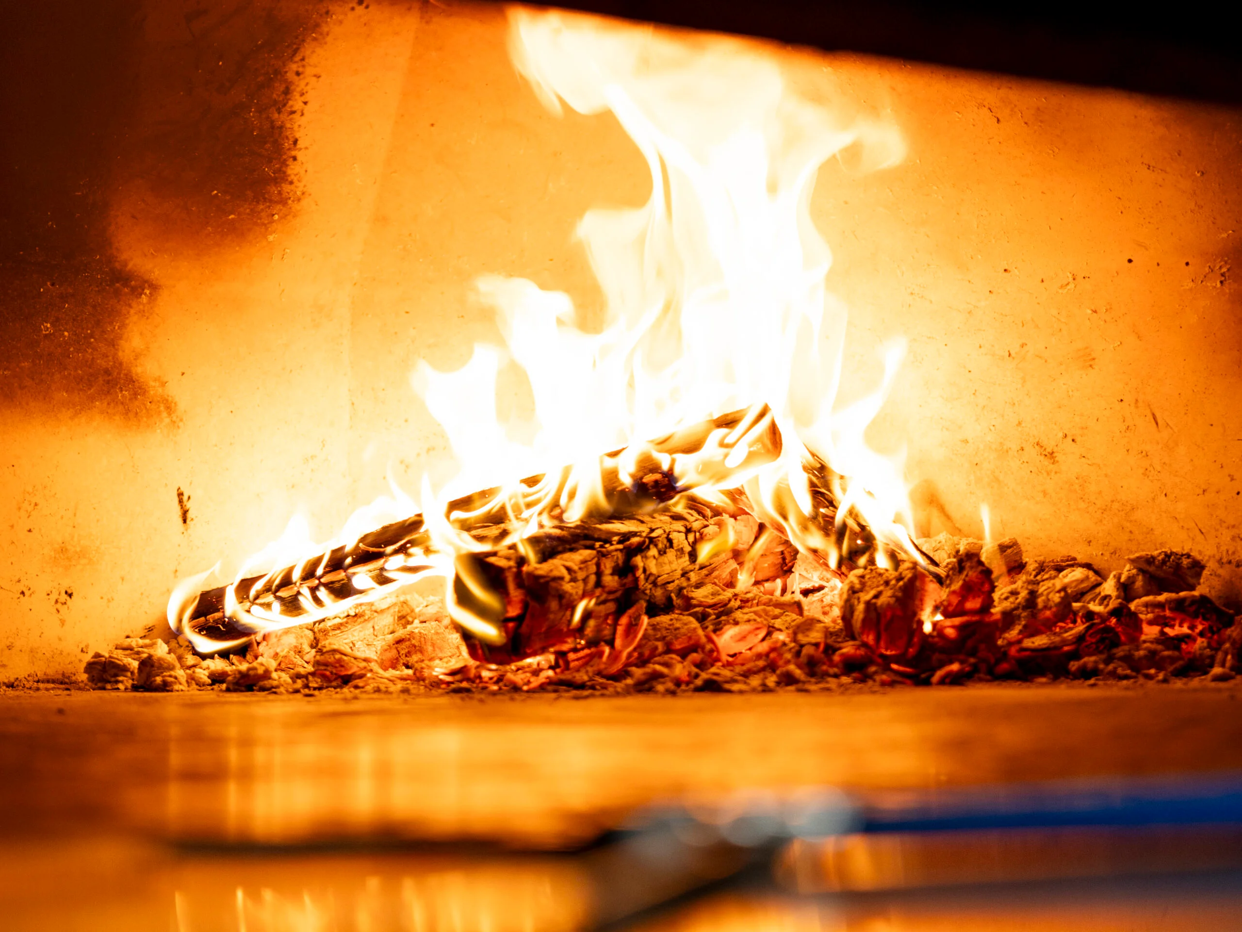 Flames in a wood-fired oven for pizza cooking