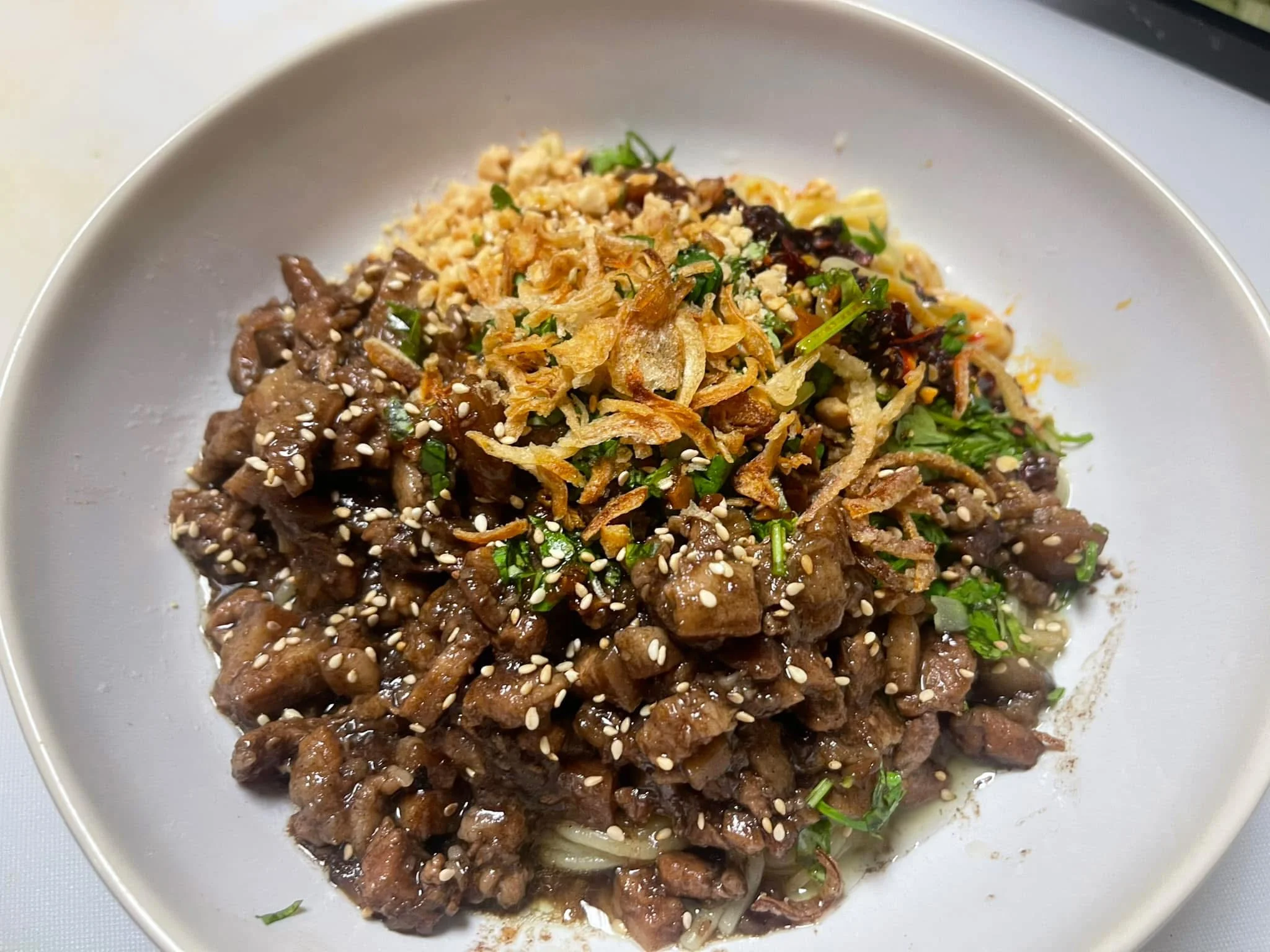 Vietnamese caramelized beef with herbs and crispy shallots