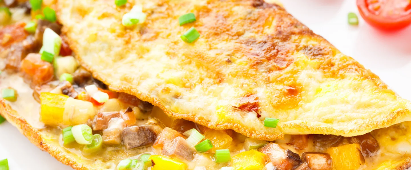 Fluffy Spanish omelette with vegetables and herbs