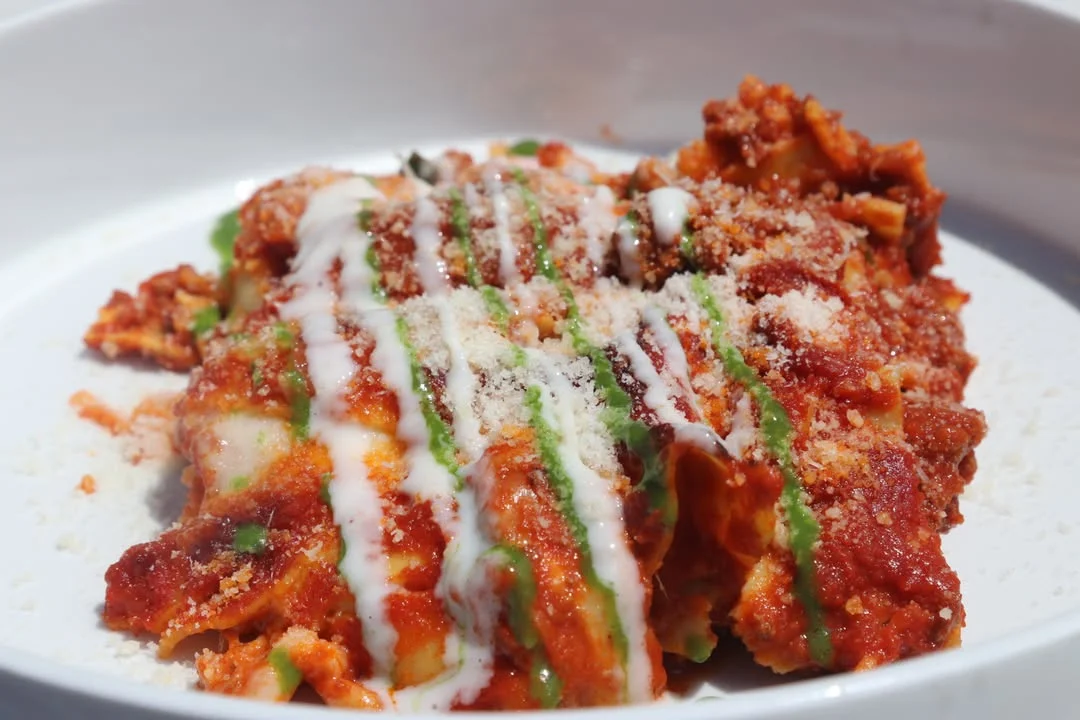 Mount Kisco Pasta with tomato based sauce and shaved Reggiano cheese