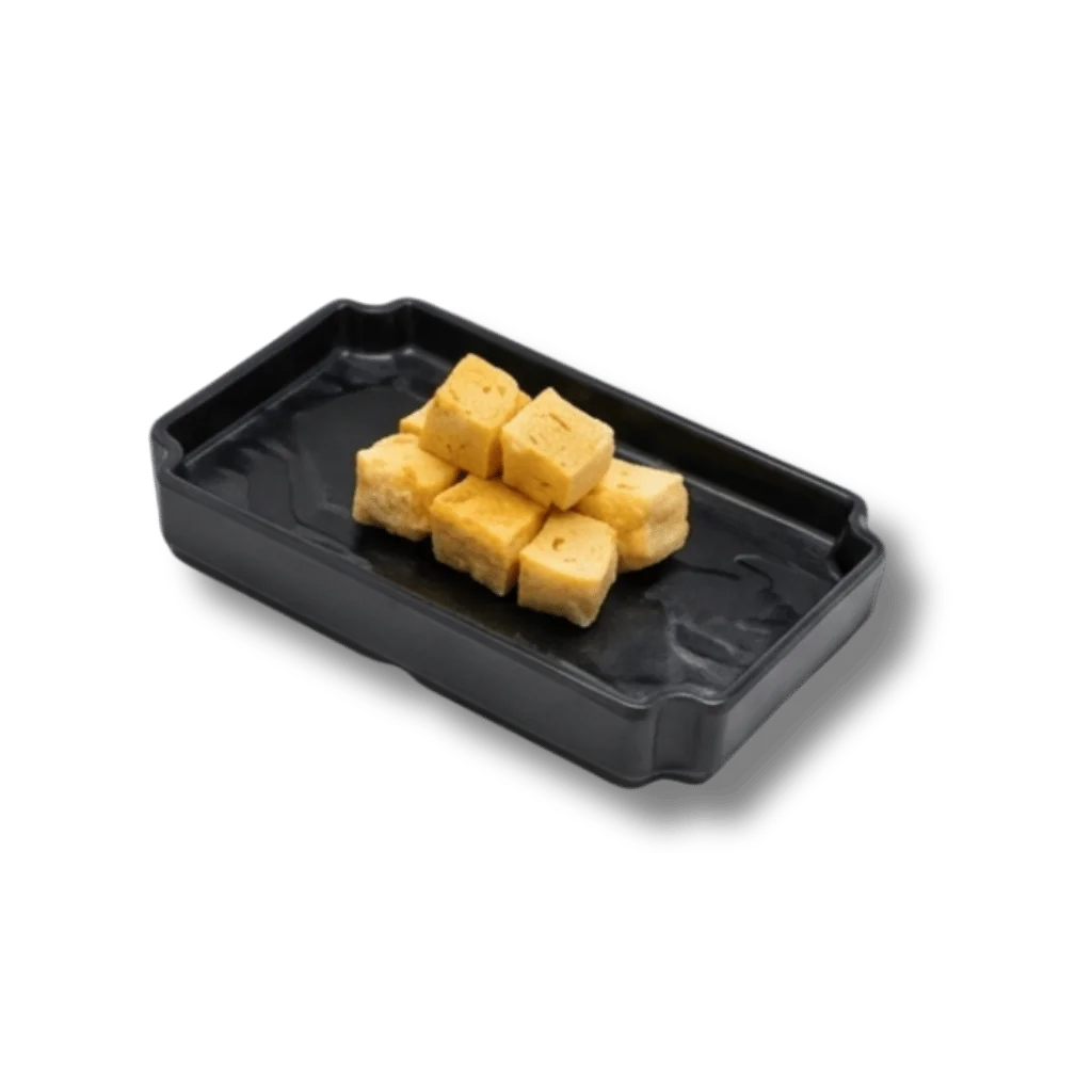 A black tray with small cubes of golden fried tofu.