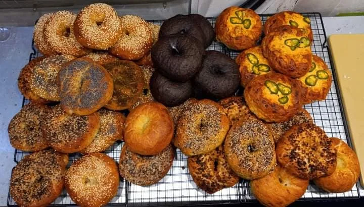 Assorted bagels including sesame and jalapeño varieties