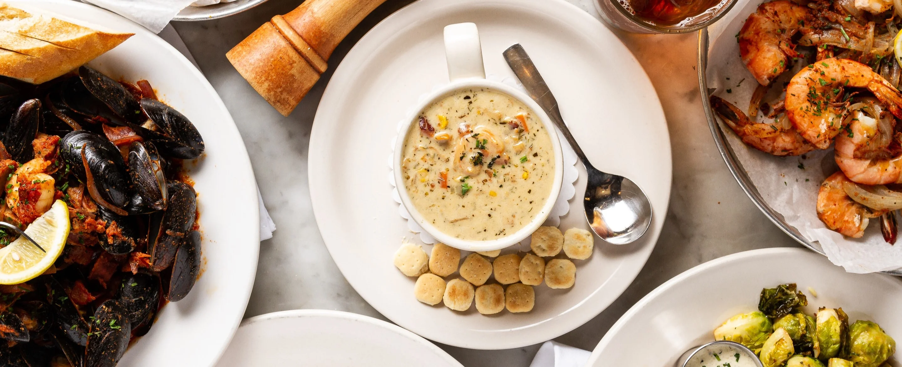 Seafood platter featuring shrimp and clam chowder
