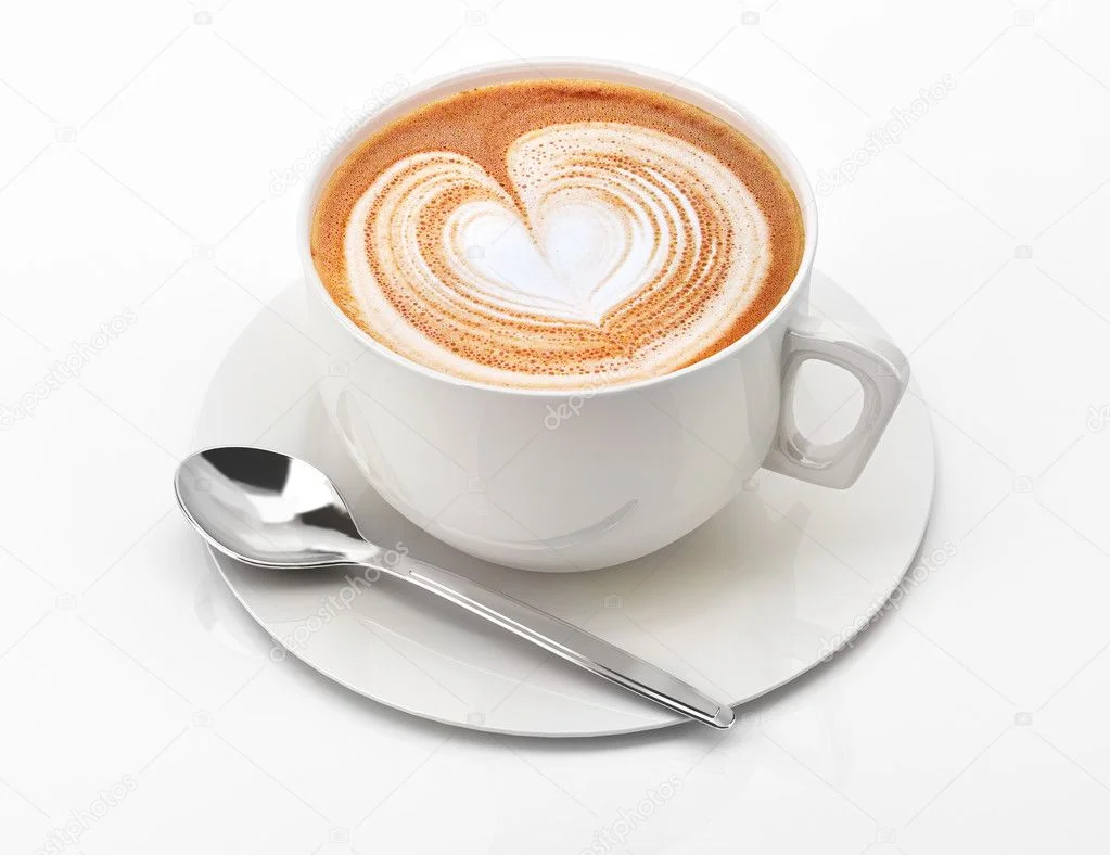 A close-up of an espresso machine pouring coffee into a white cup, with reflections visible on the polished surface.