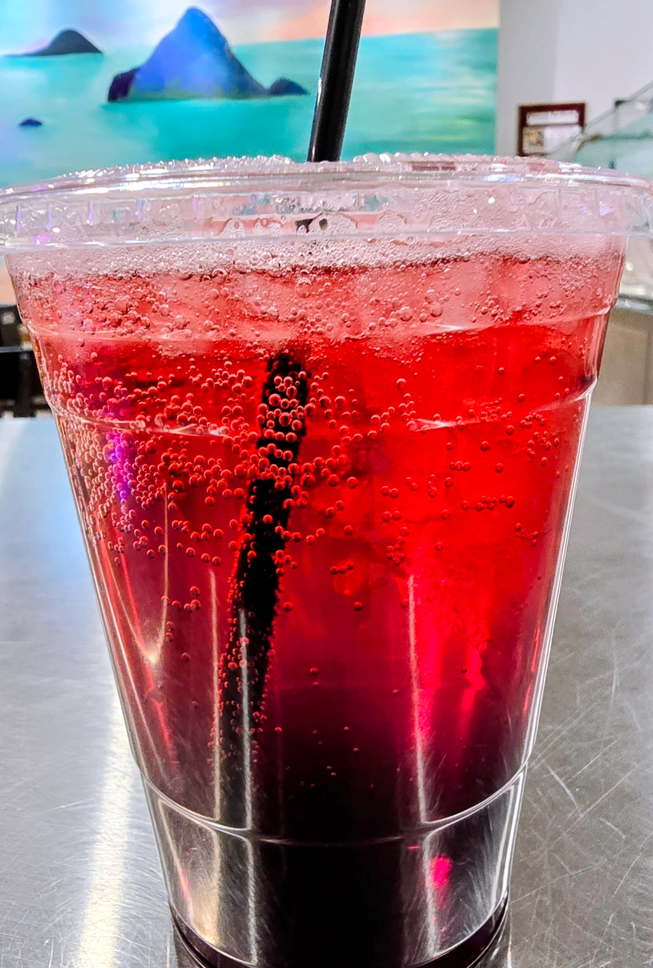 Refreshing carbonated berry drink in a clear cup