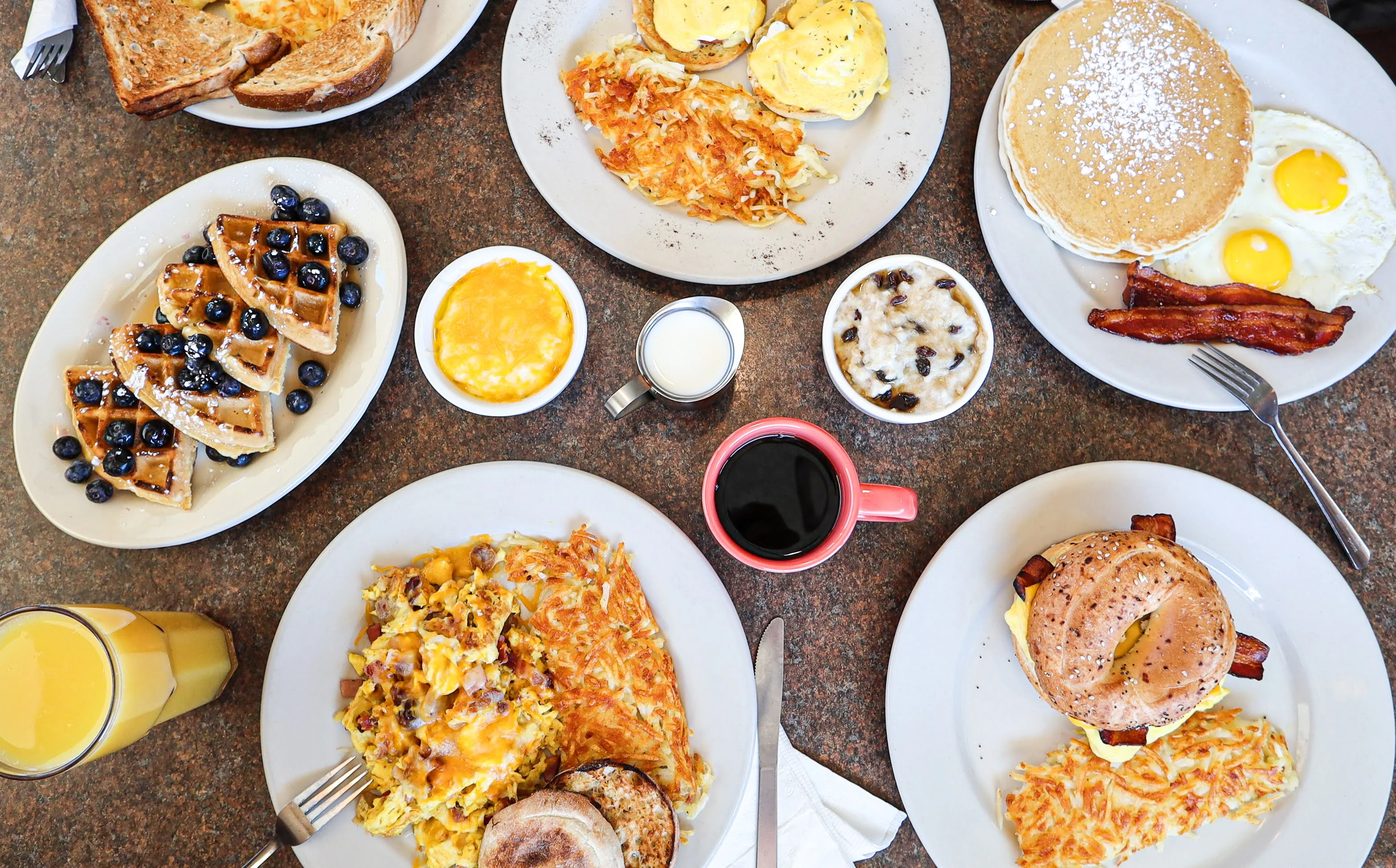 Classic American breakfast spread with pancakes and waffles