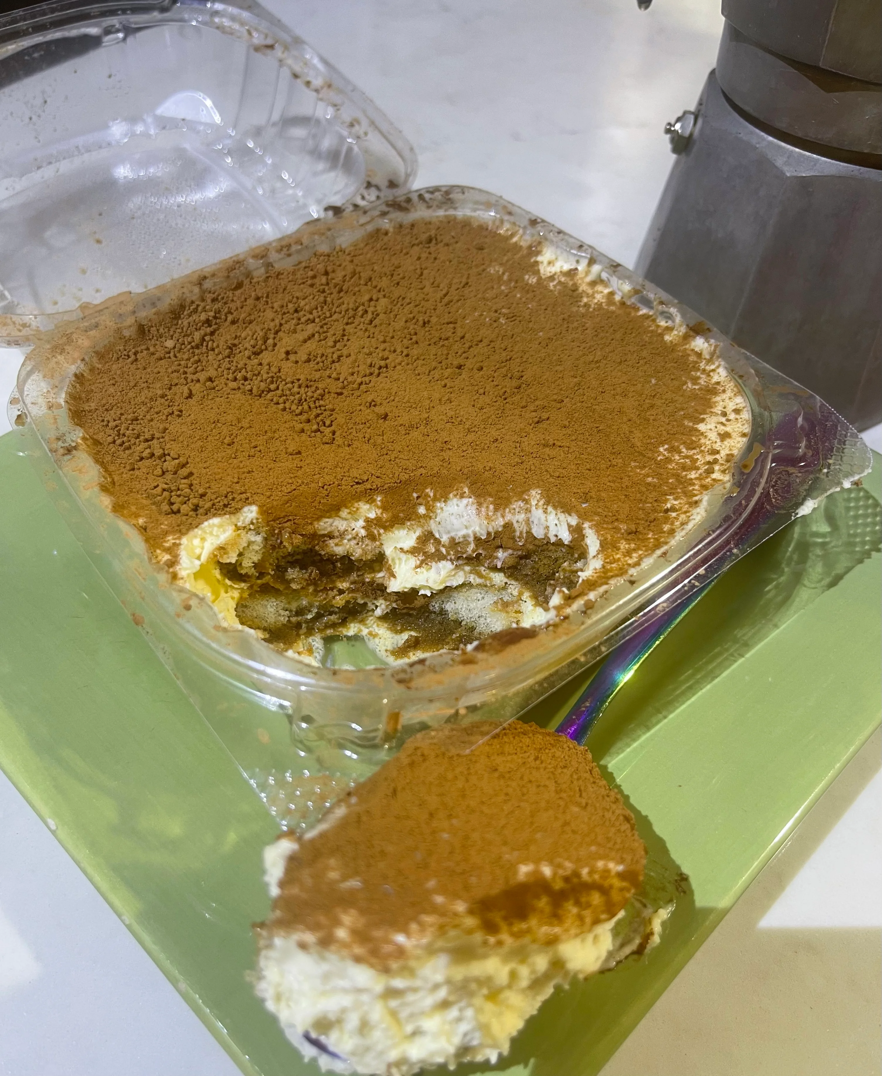 Delicious Italian tiramisu dessert with cocoa powder topping
