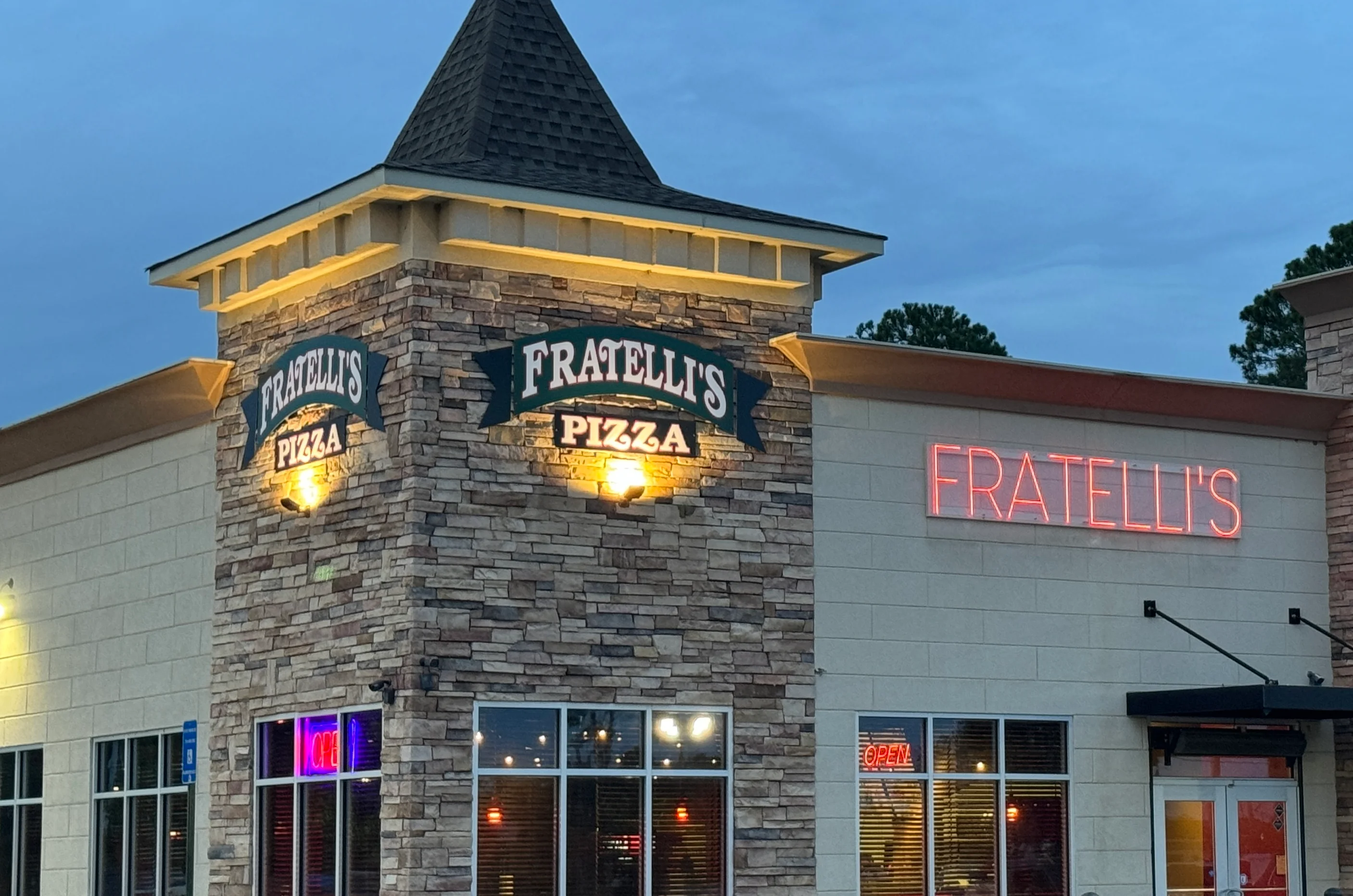 Fratelli's Pizza restaurant exterior at dusk
