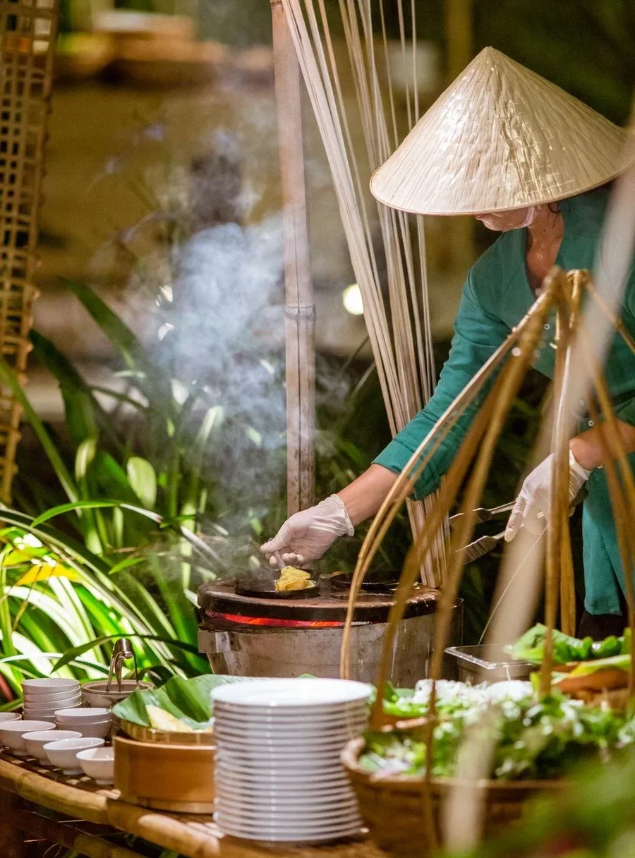 A restaurant chef preparing a dish
