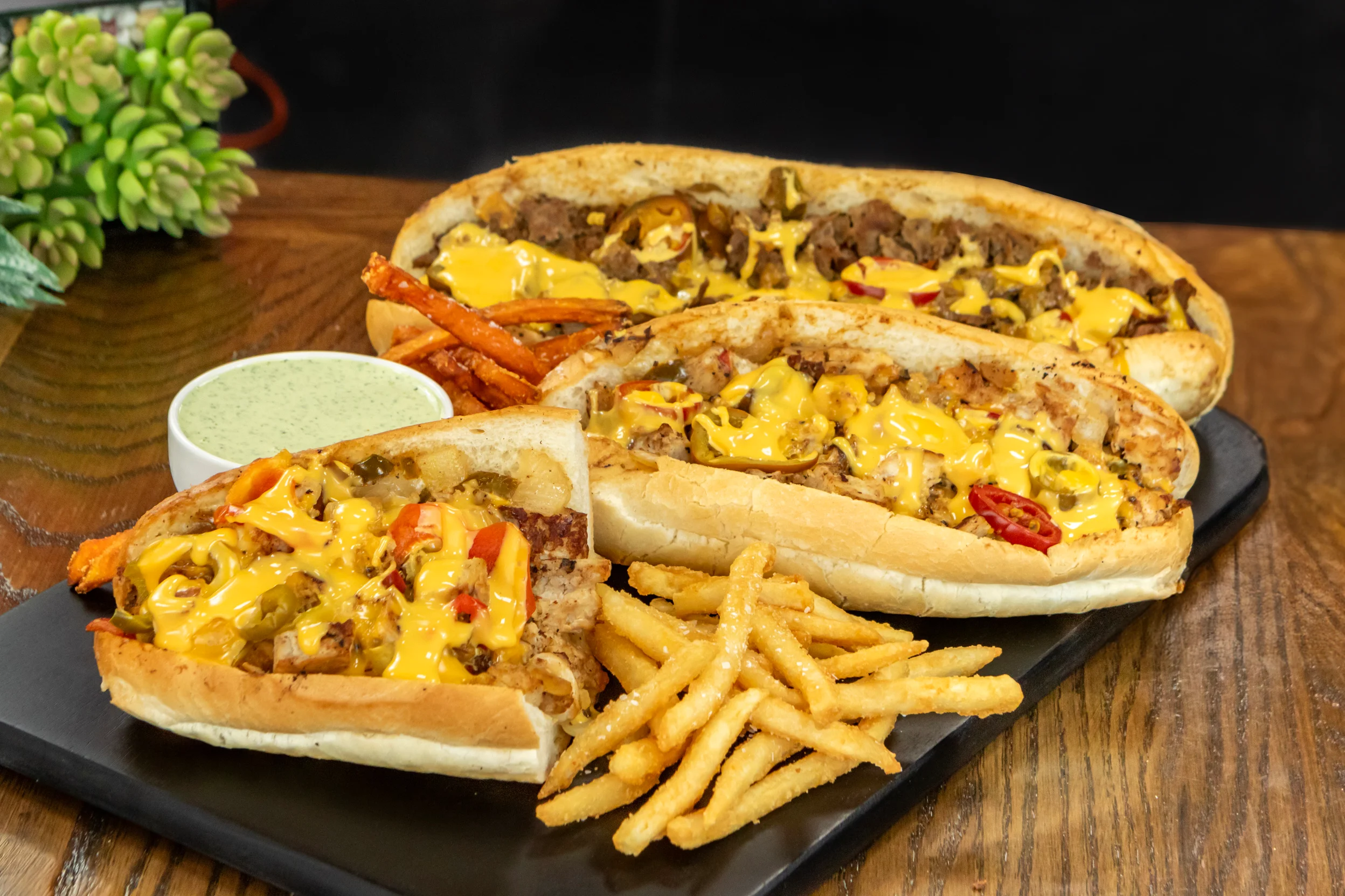 Loaded cheesesteak sandwiches with fries