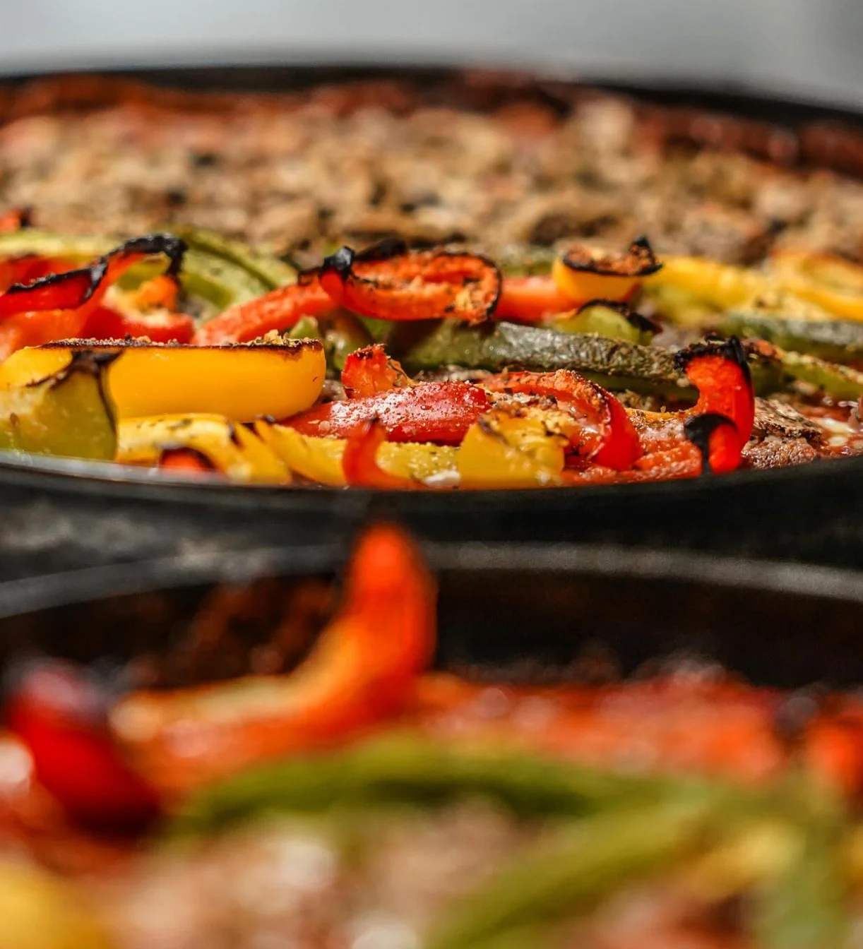 Colorful vegetable pizza from a wood-fired oven