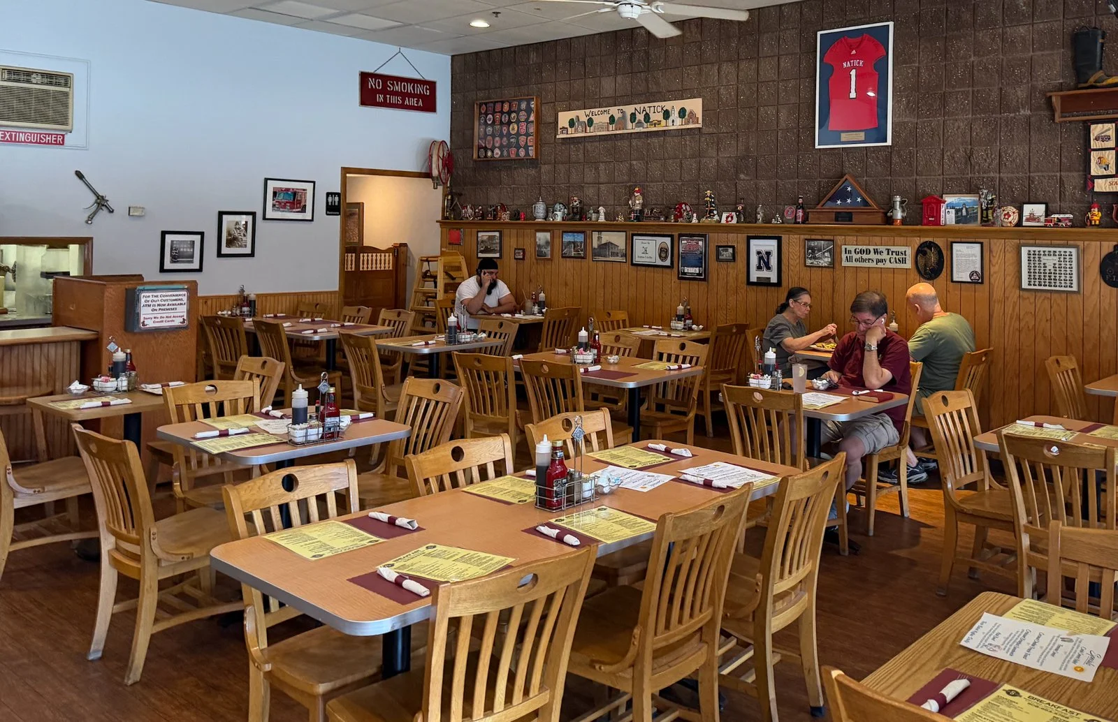 Cozy restaurant interior with wooden tables and warm decor