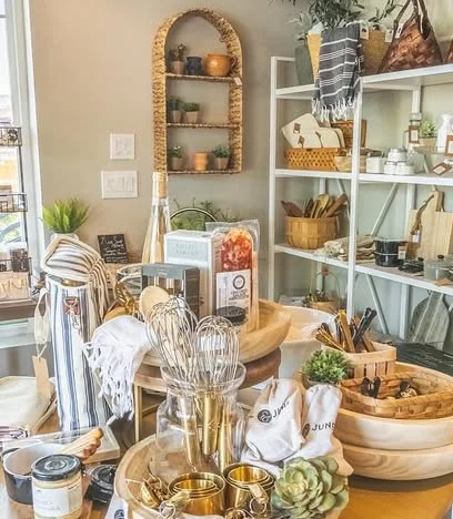 Well-stocked grocery store interior with shelves and baskets