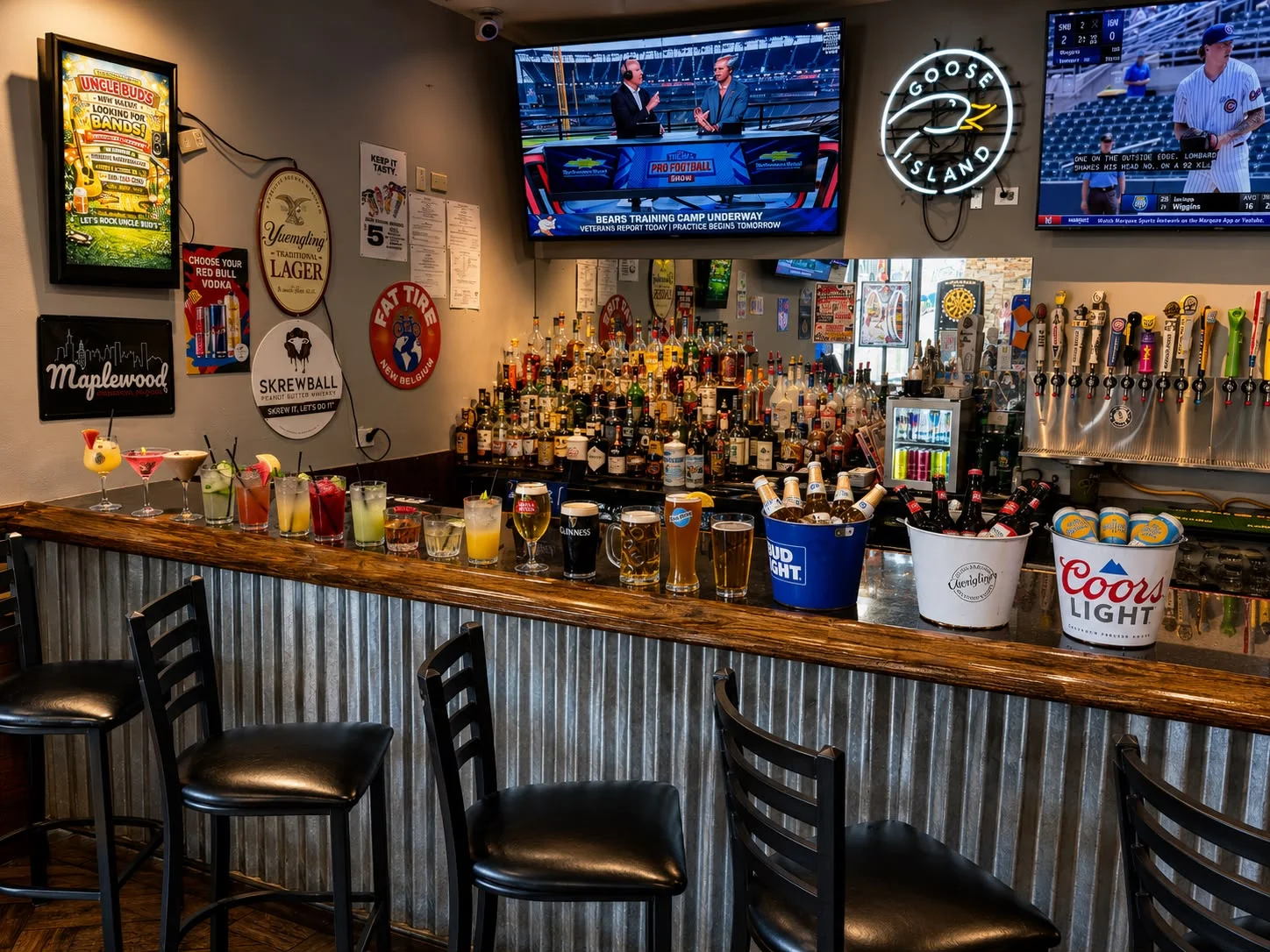 Vibrant bar scene with cocktails and beer buckets