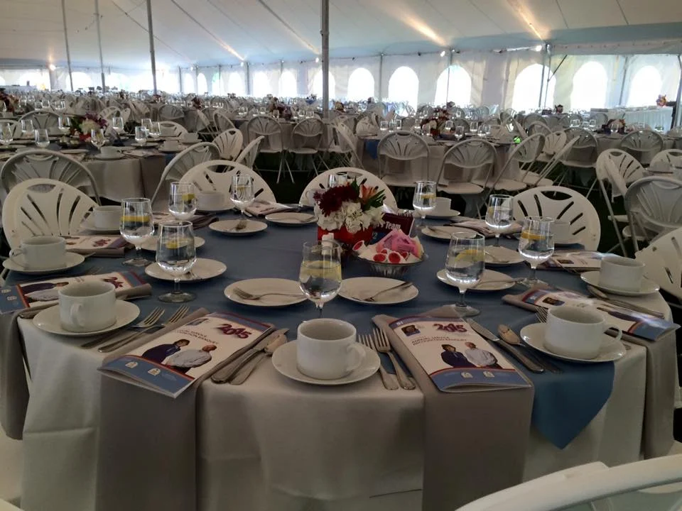 Elegant banquet setup with tables and floral centerpieces