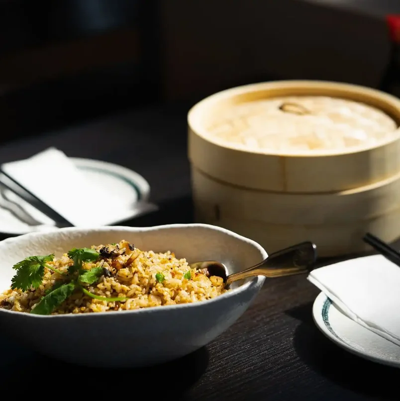 Plate of Chinese fried rice garnished with cilantro