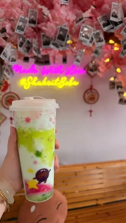 Boba at ShakeiT Boba beneath the pink blossoms