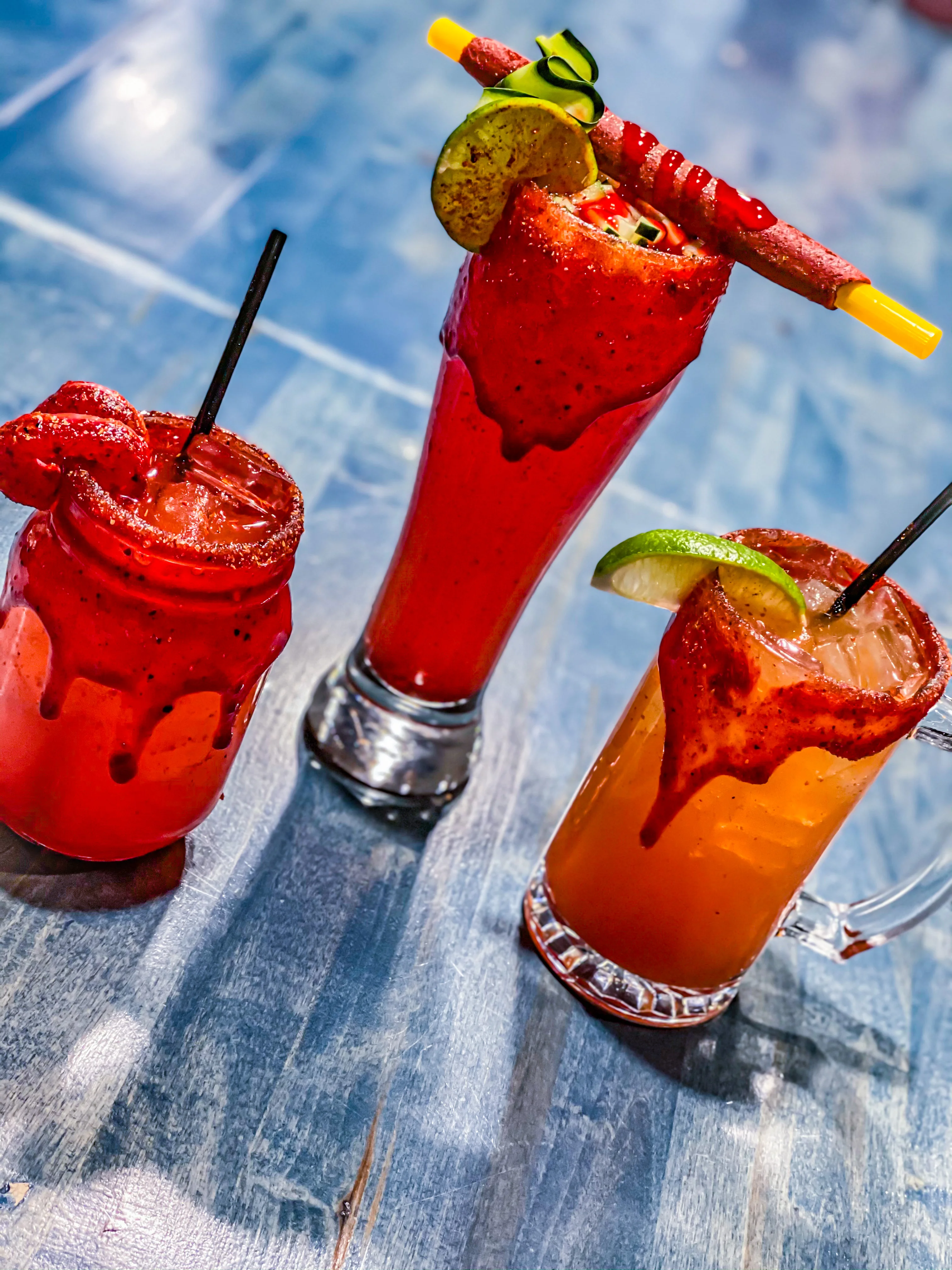 Colorful Mexican micheladas with garnishes