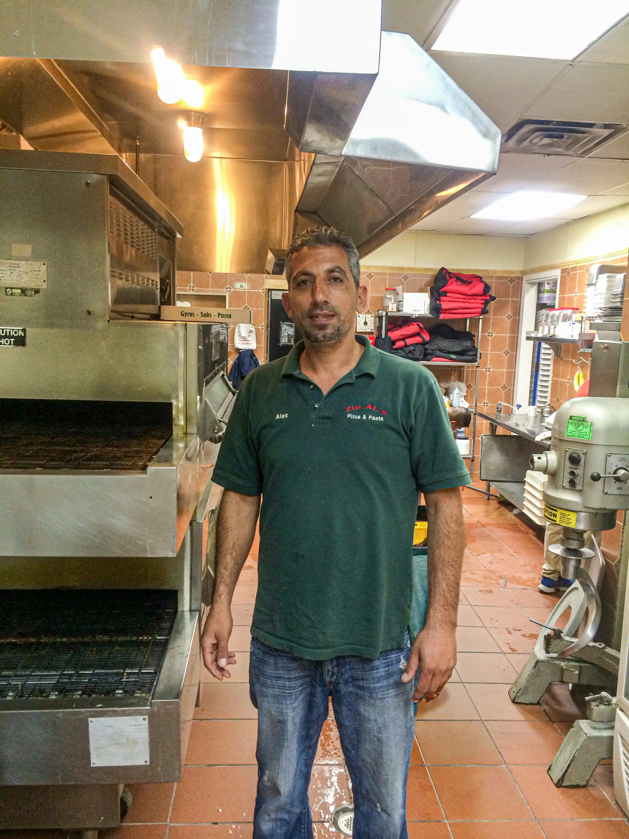 Chef in a bustling restaurant kitchen