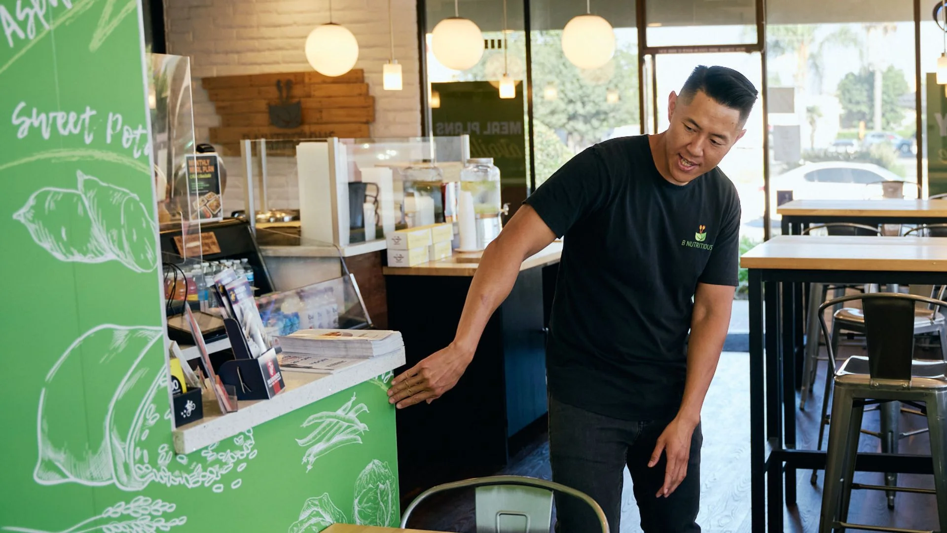 Restaurant staff presenting menu in a modern eatery
