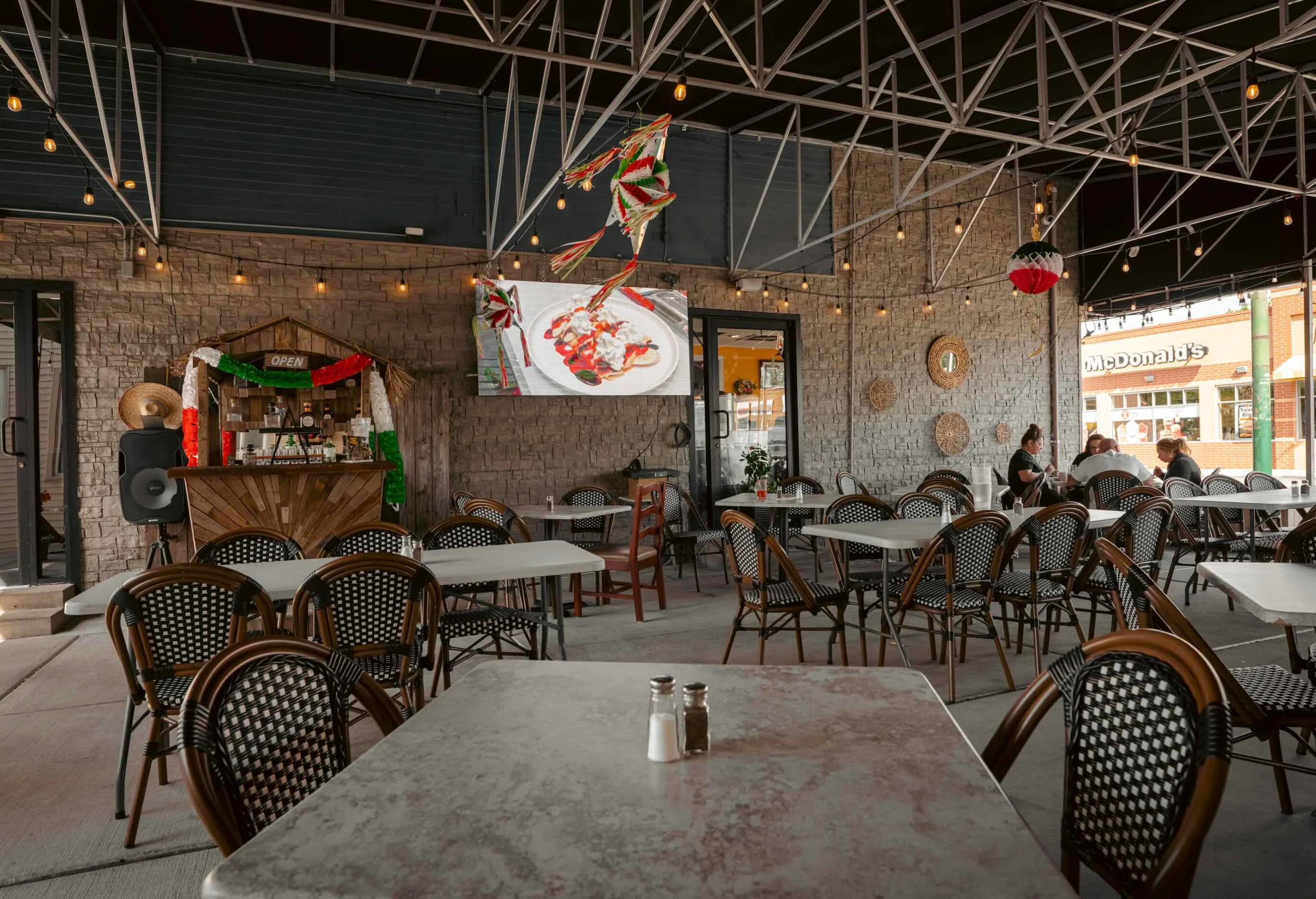 Charming outdoor dining area with festive decor