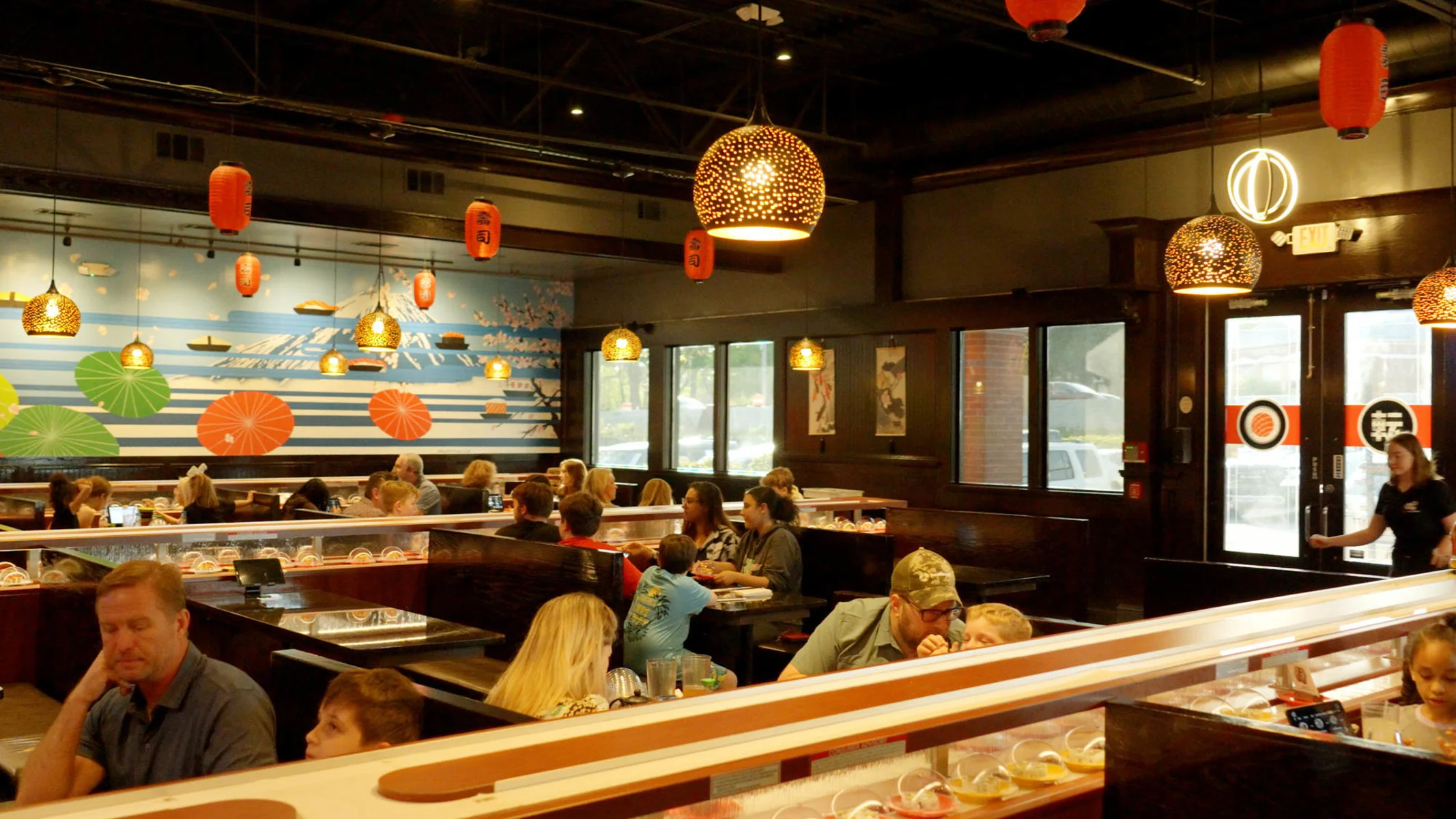 Cozy sushi restaurant interior with vibrant decor and warm lighting