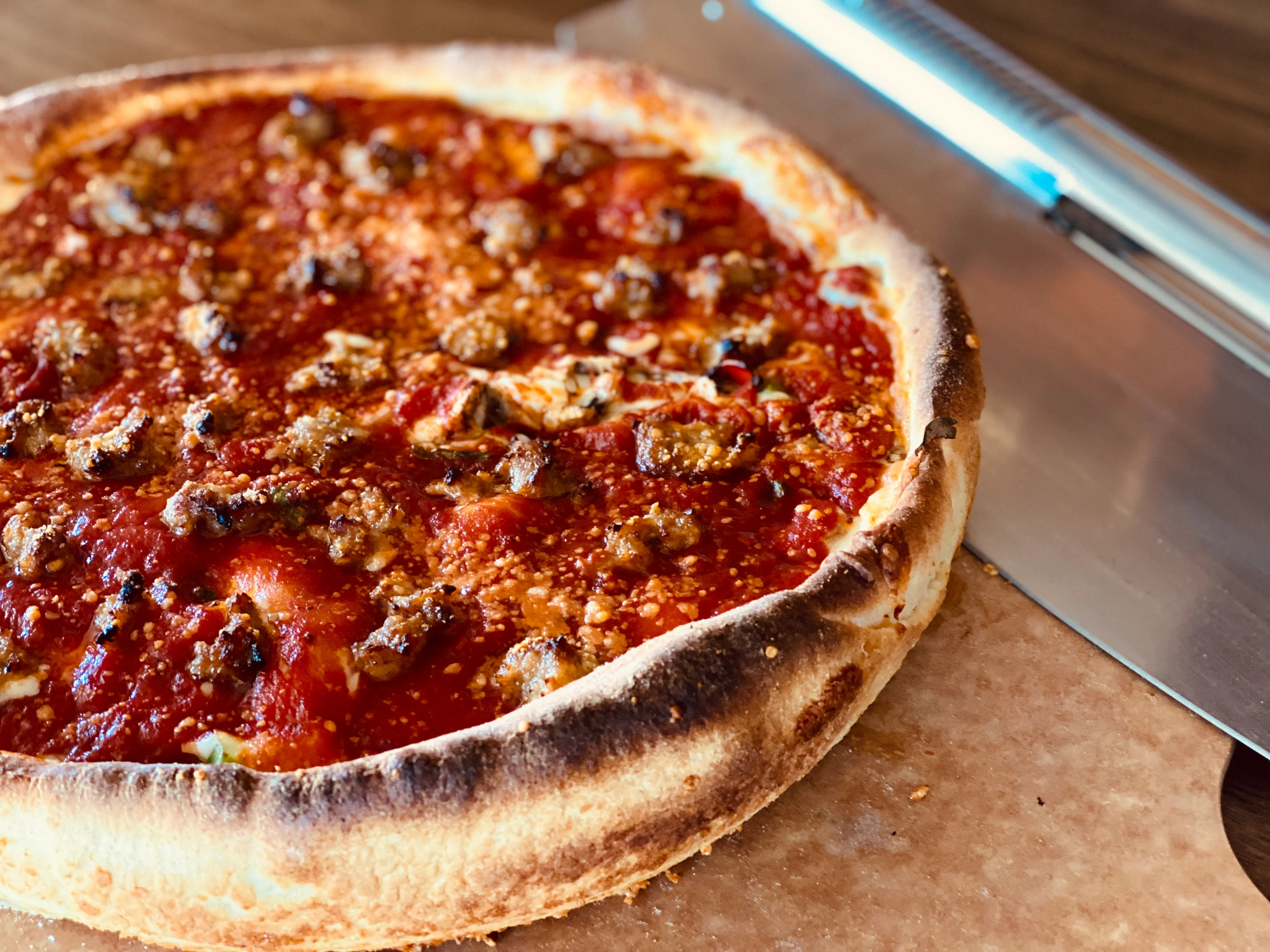 Chicago-style deep dish pizza with sausage and cheese