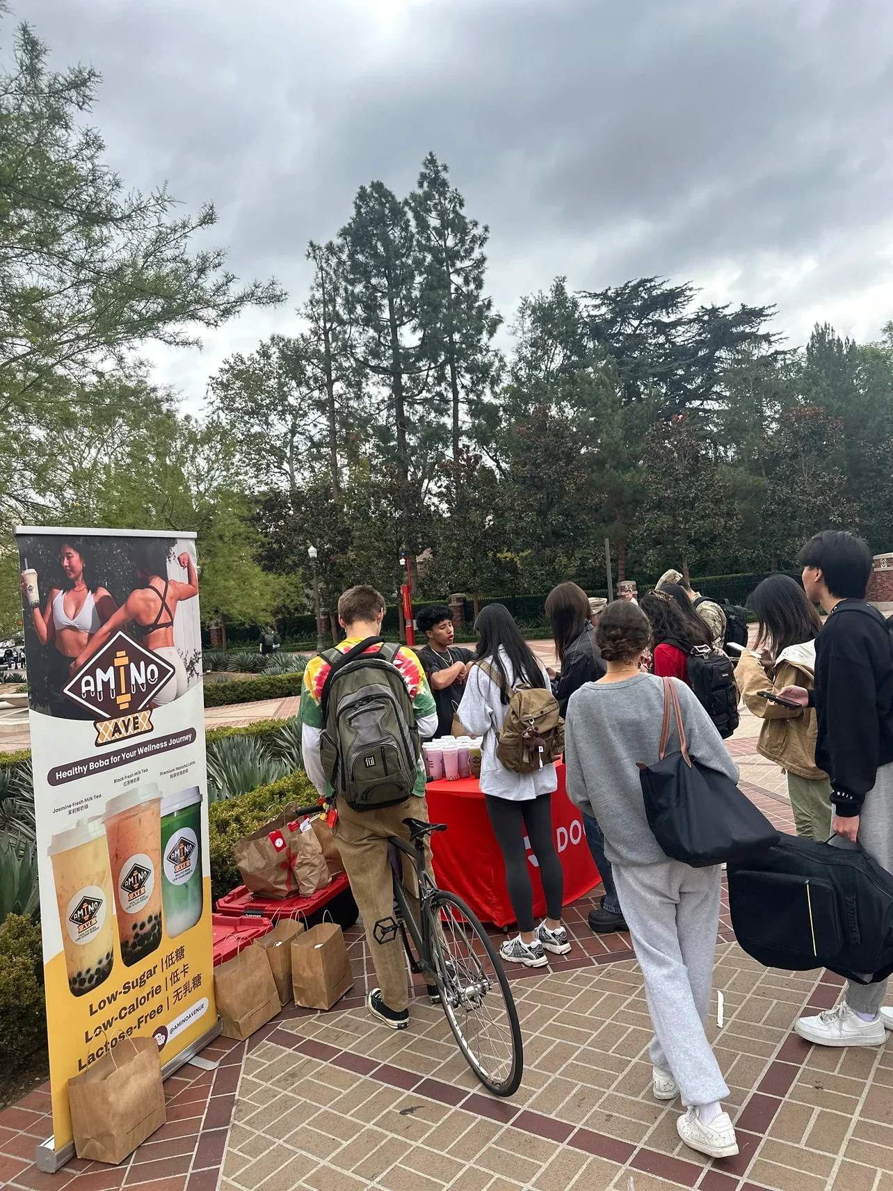 Students enjoying healthy boba drinks at a campus event
