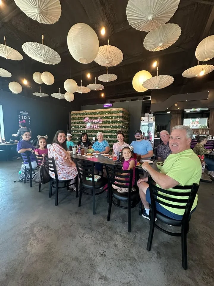 A group of people inside of Mama Kim's restaurant