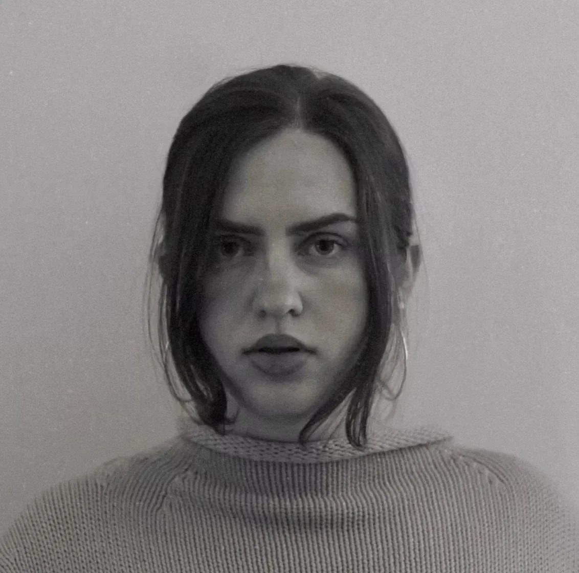 Black and white portrait of a woman with a serious expression