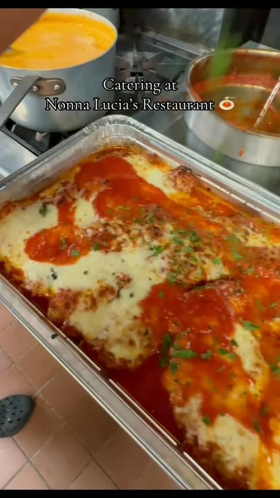 Baked lasagna with marinara sauce and melted cheese