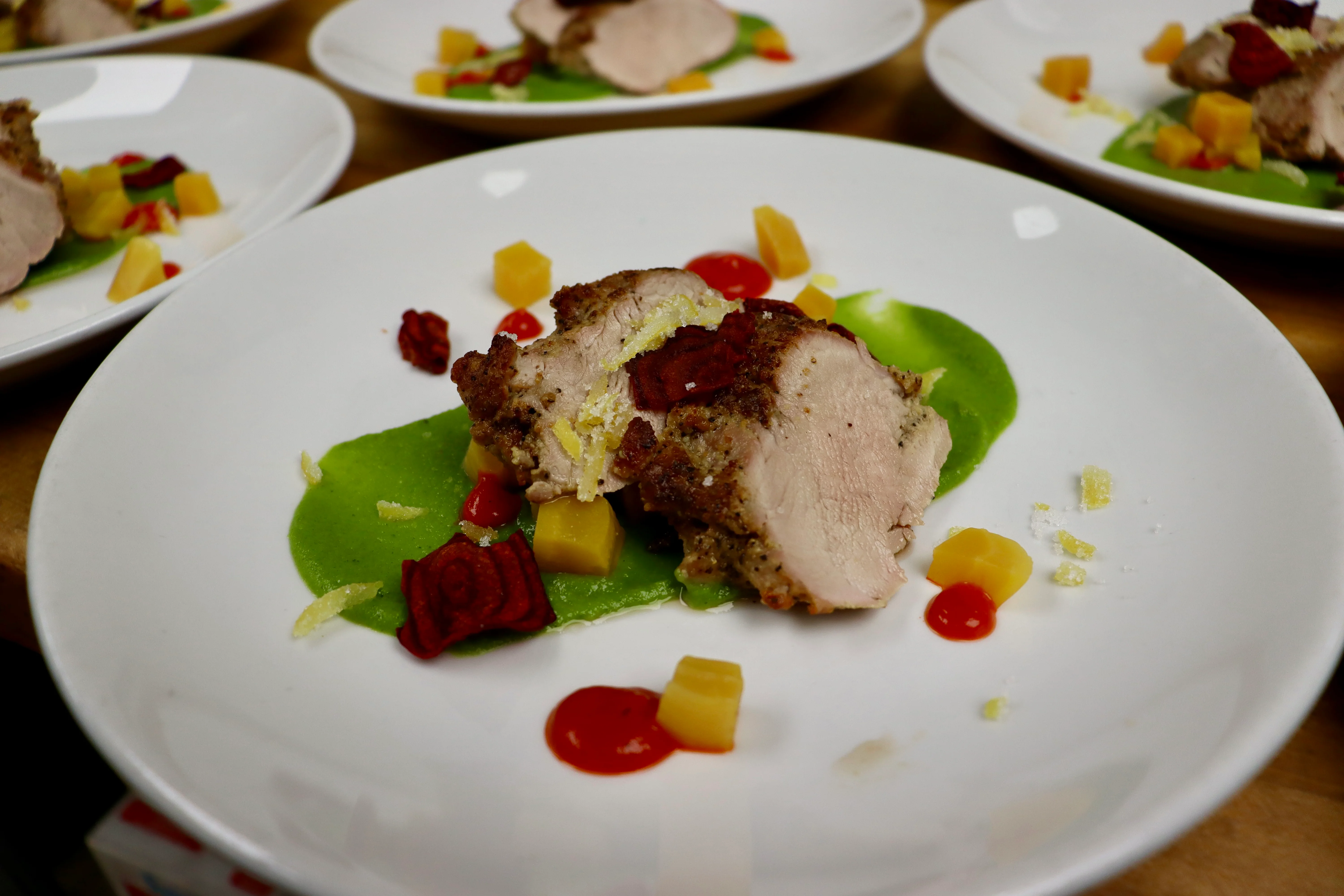 Herb-crusted chicken with vibrant green puree
