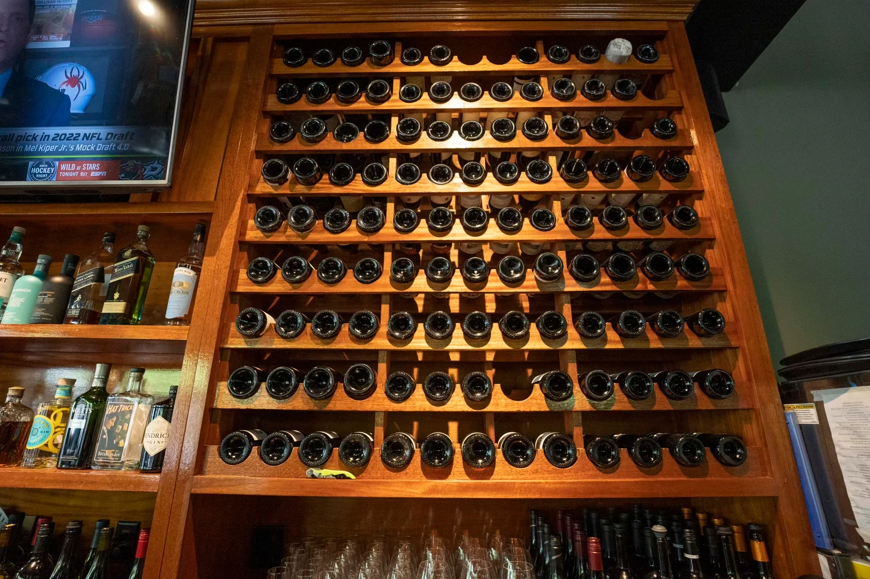 Wine bottle display in a stylish bar setting