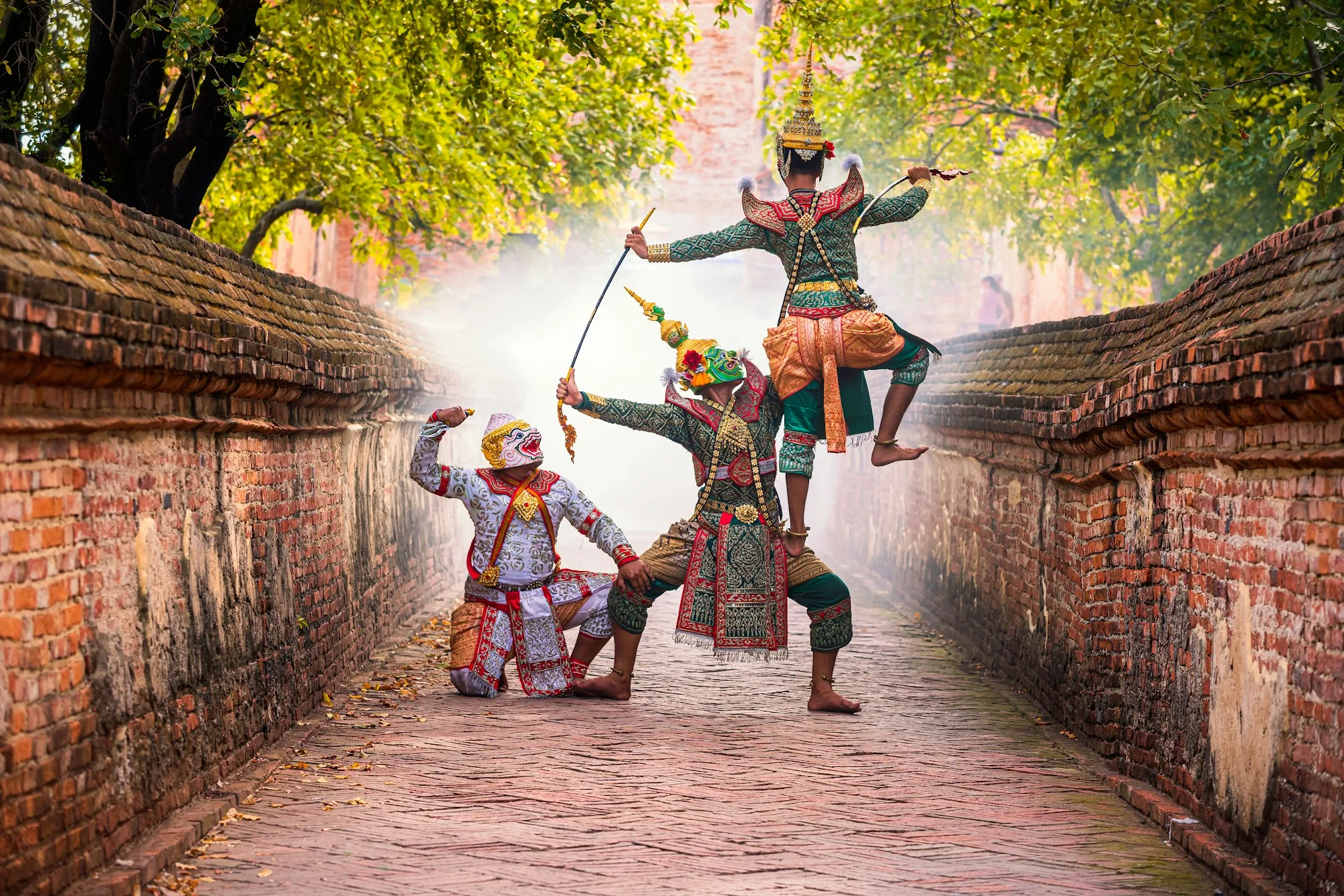 Traditional Thai dance performance in a historic setting