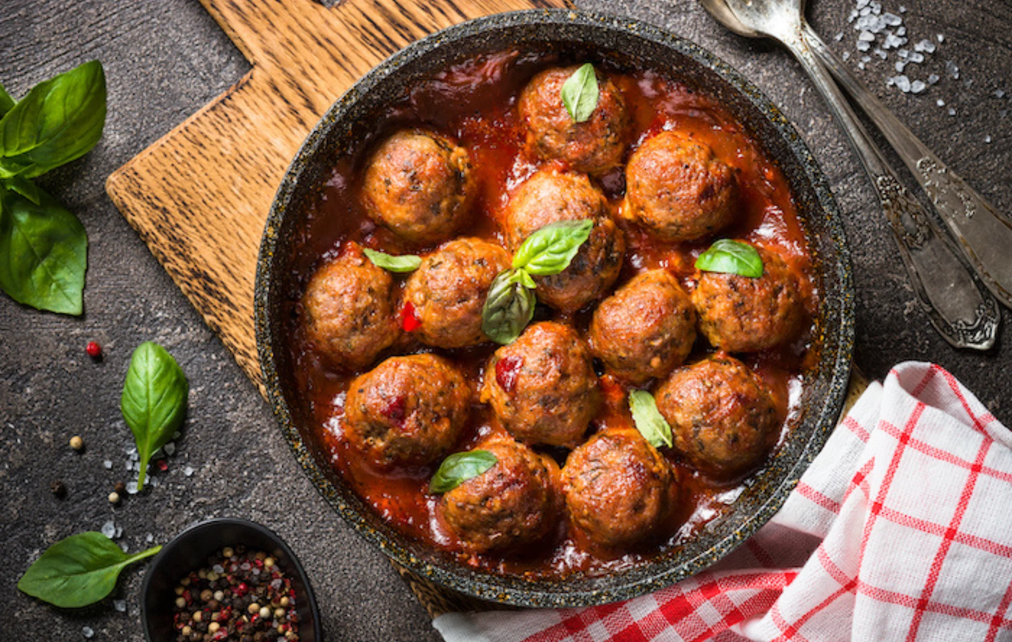 Italian meatballs in marinara sauce with fresh basil