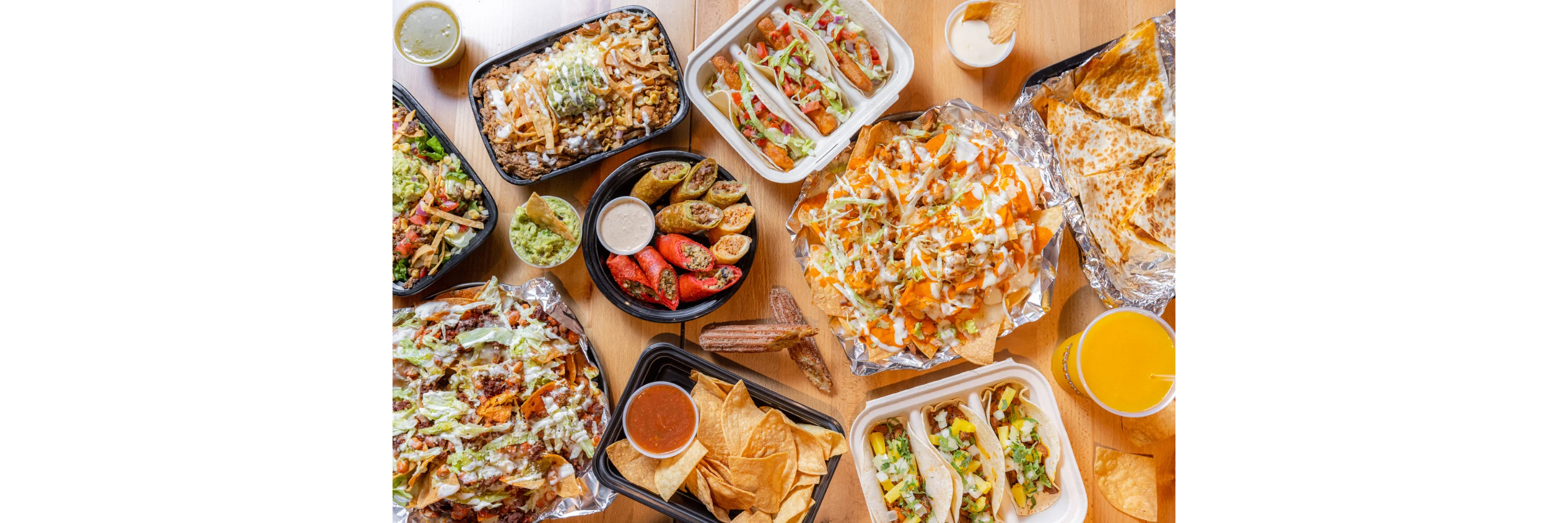 Colorful Mexican feast with nachos, tacos, and guacamole