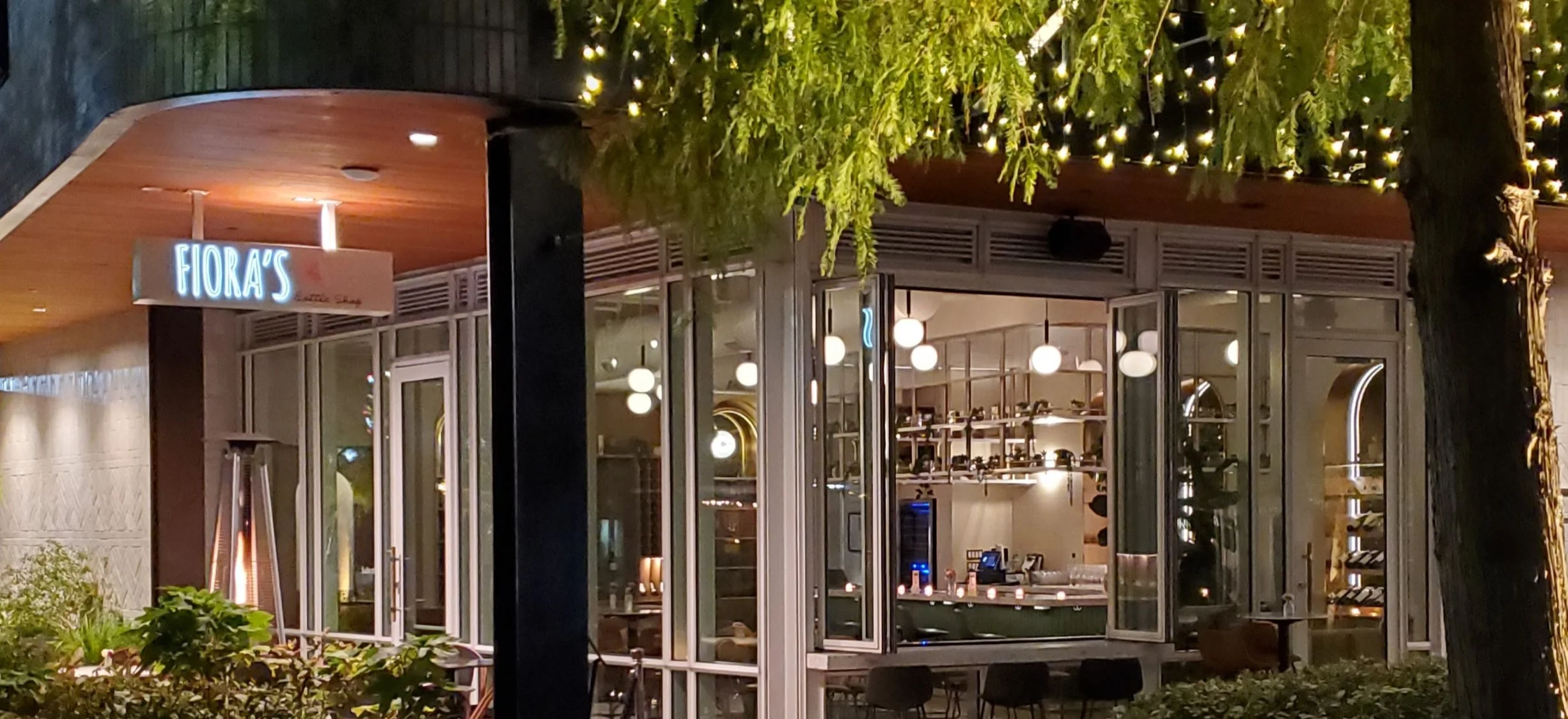 Charming restaurant exterior with warm lighting and modern design