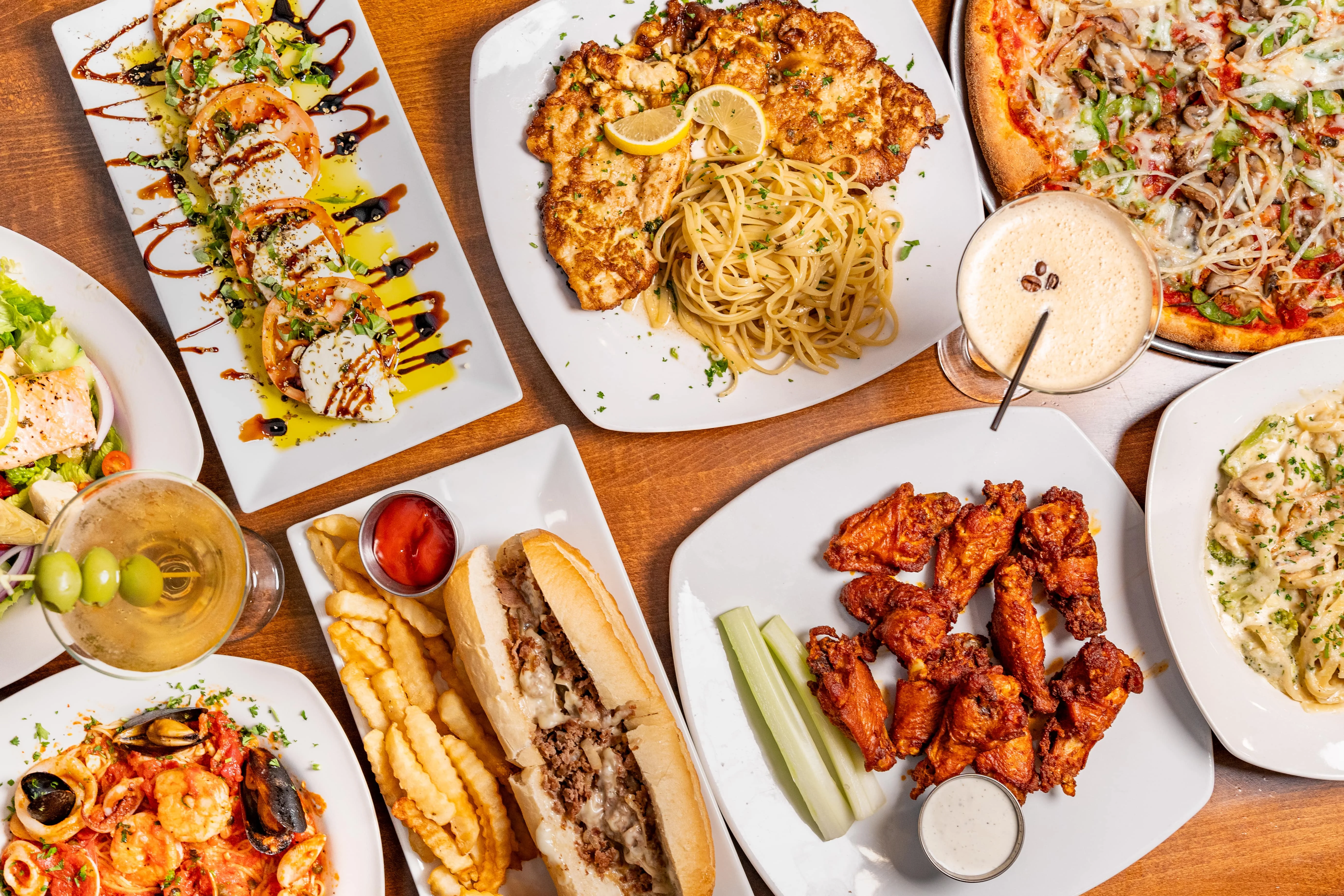 Assorted Italian-American dishes including pizza and wings