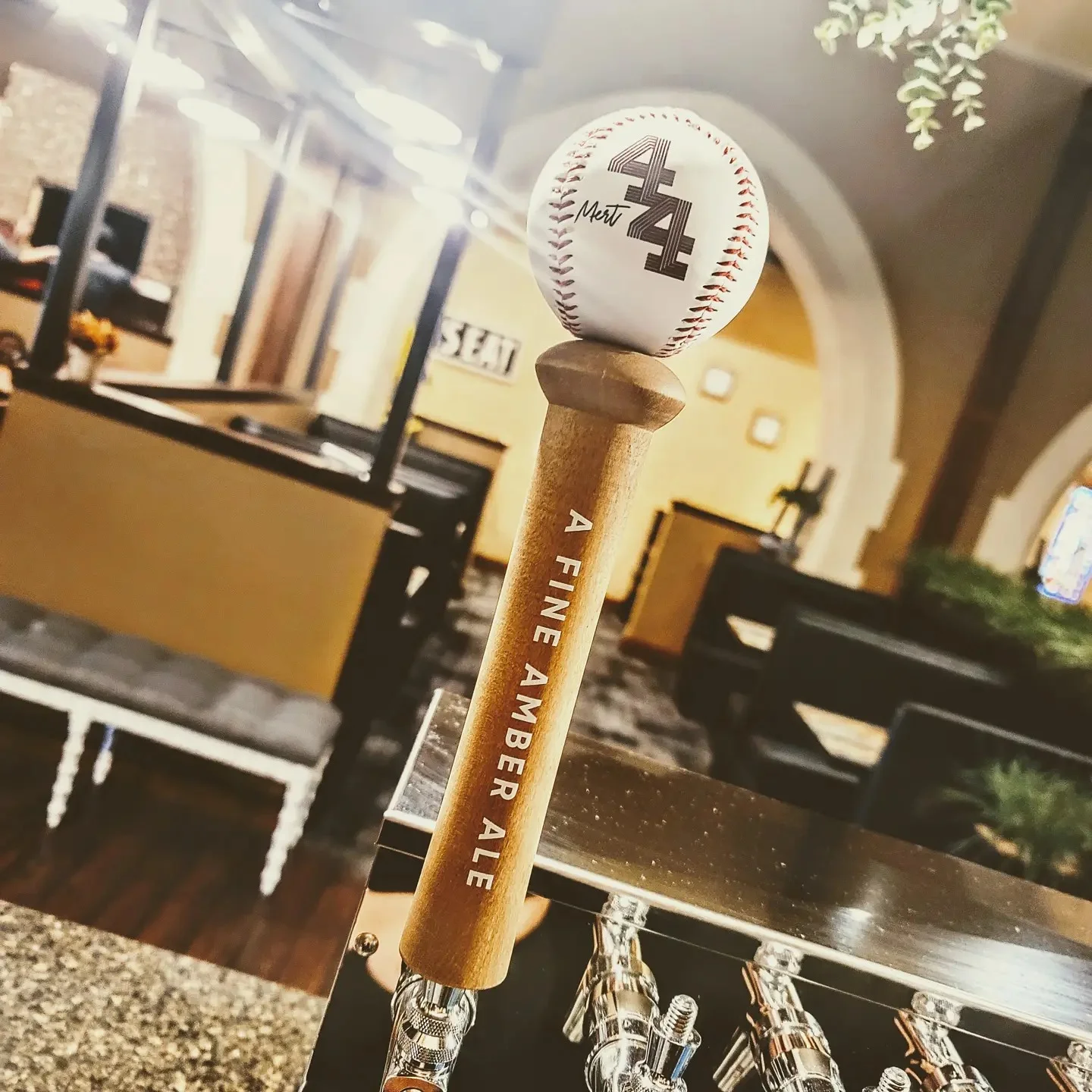 Craft beer tap featuring an amber ale in a cozy restaurant setting